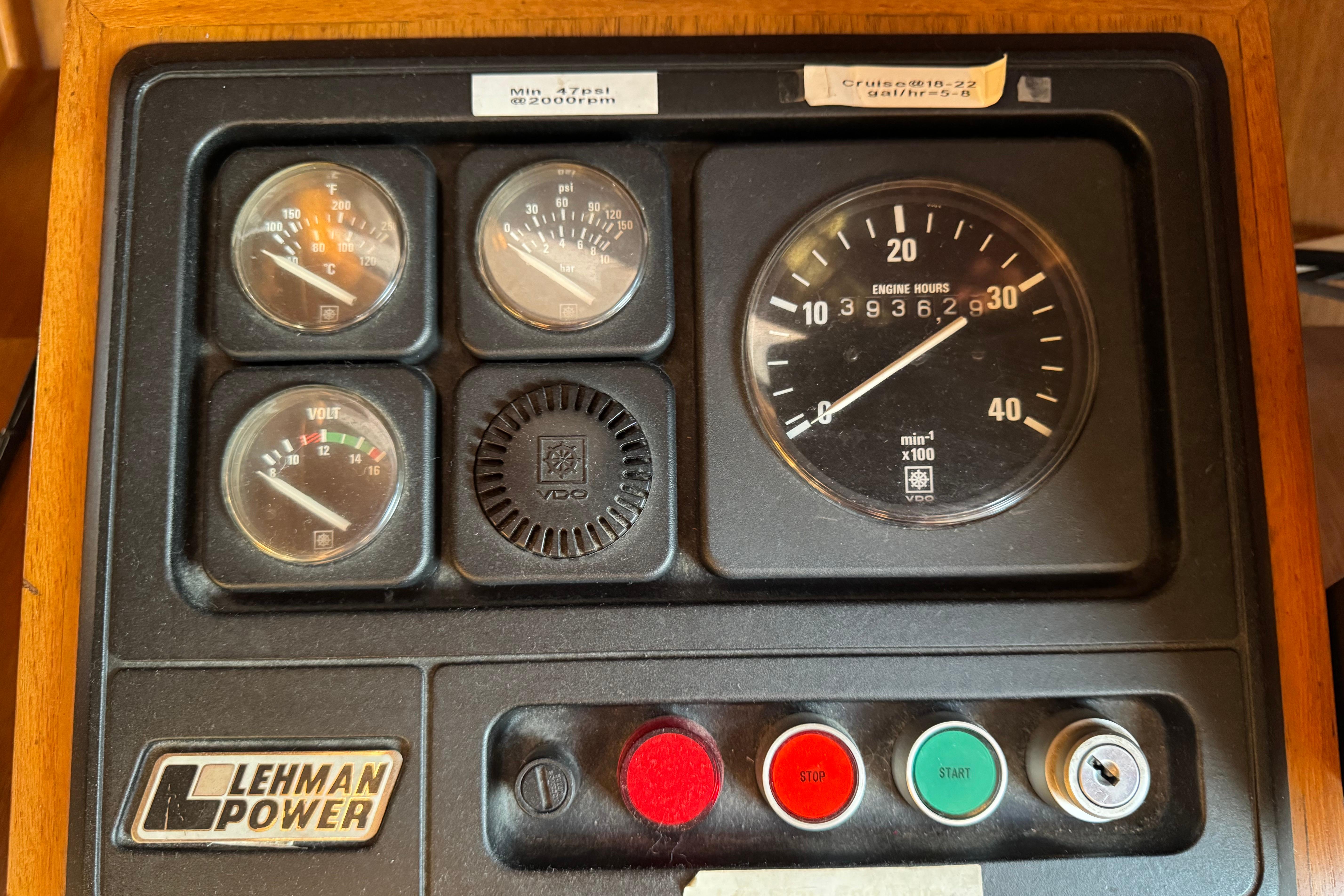 Control panel of a 1987 President 37 with Lehman Power gauges and engine hour meter.