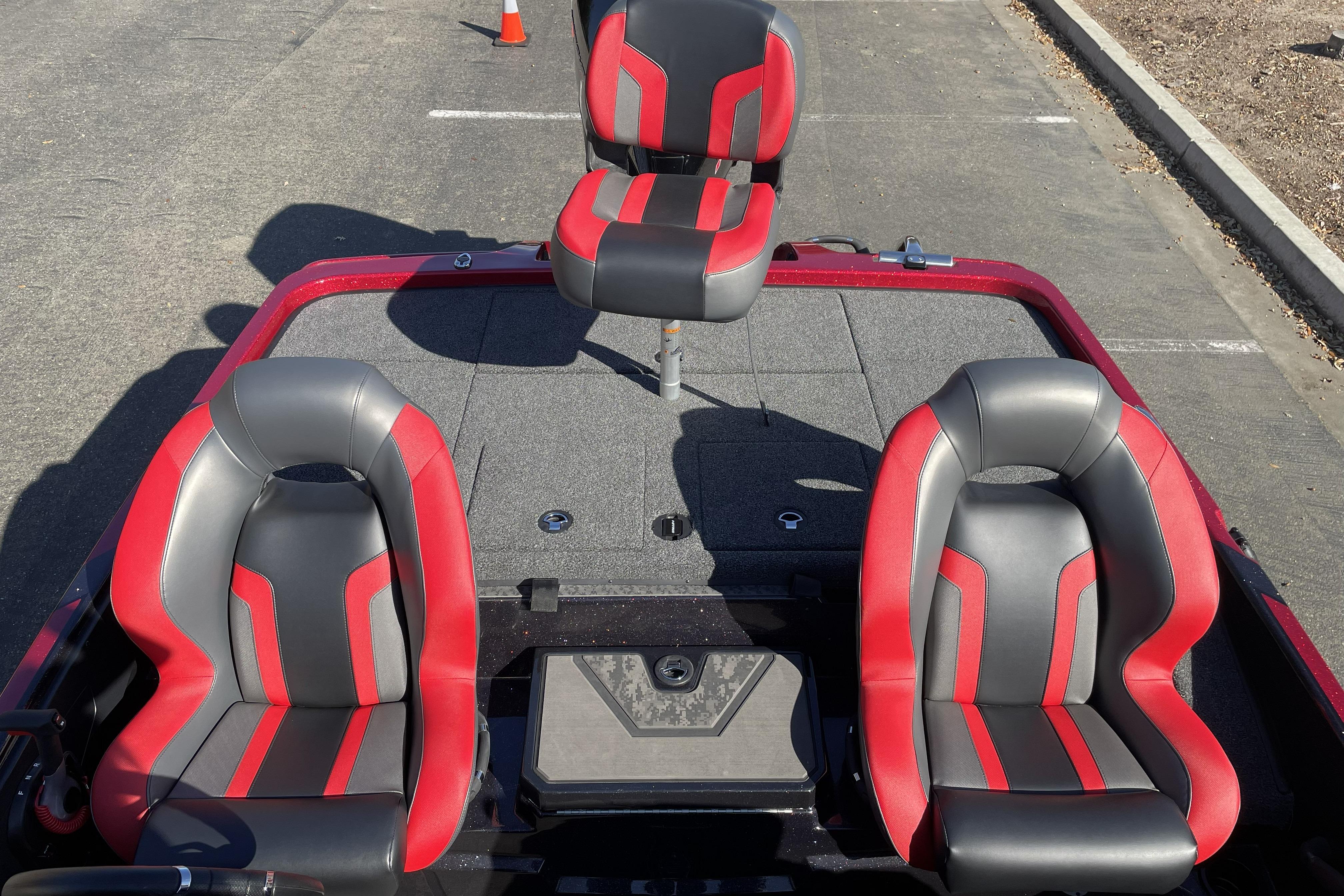 2026 Nitro Z19 XL boat interior with red and black seats on a sunny day.