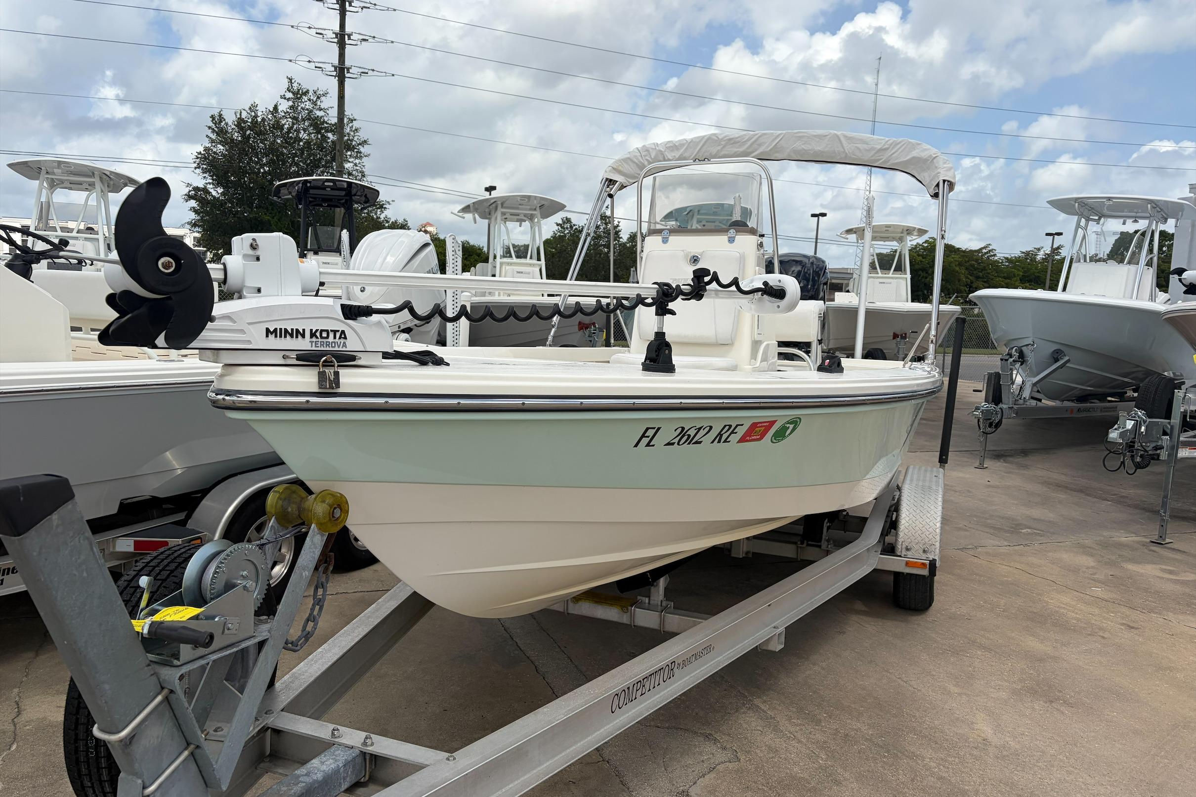 2017 Pathfinder 2200 TRS boat on trailer with Minn Kota motor, parked outdoors.