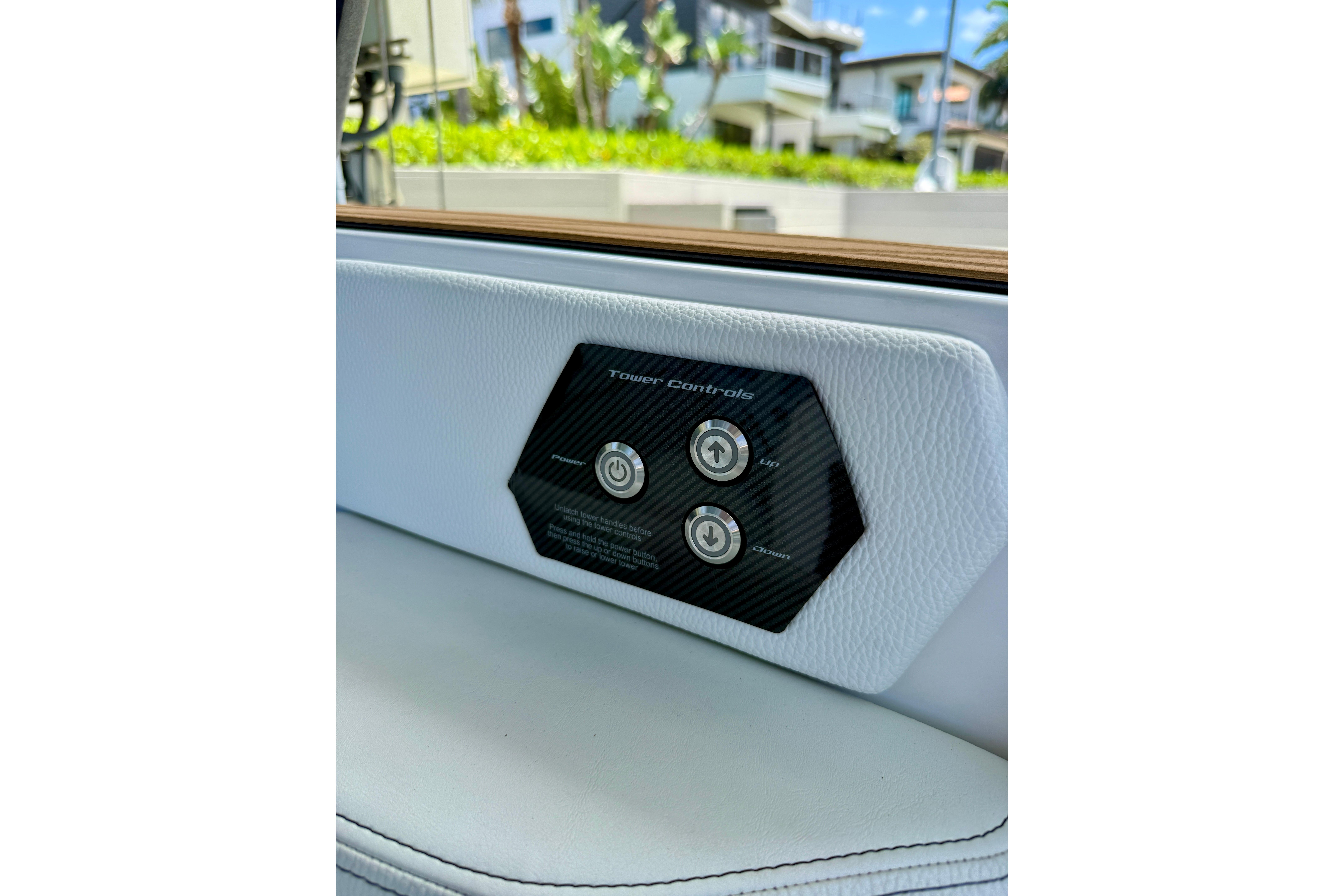 2024 Nautique Super Air Nautique GS20 tower controls on white interior panel.