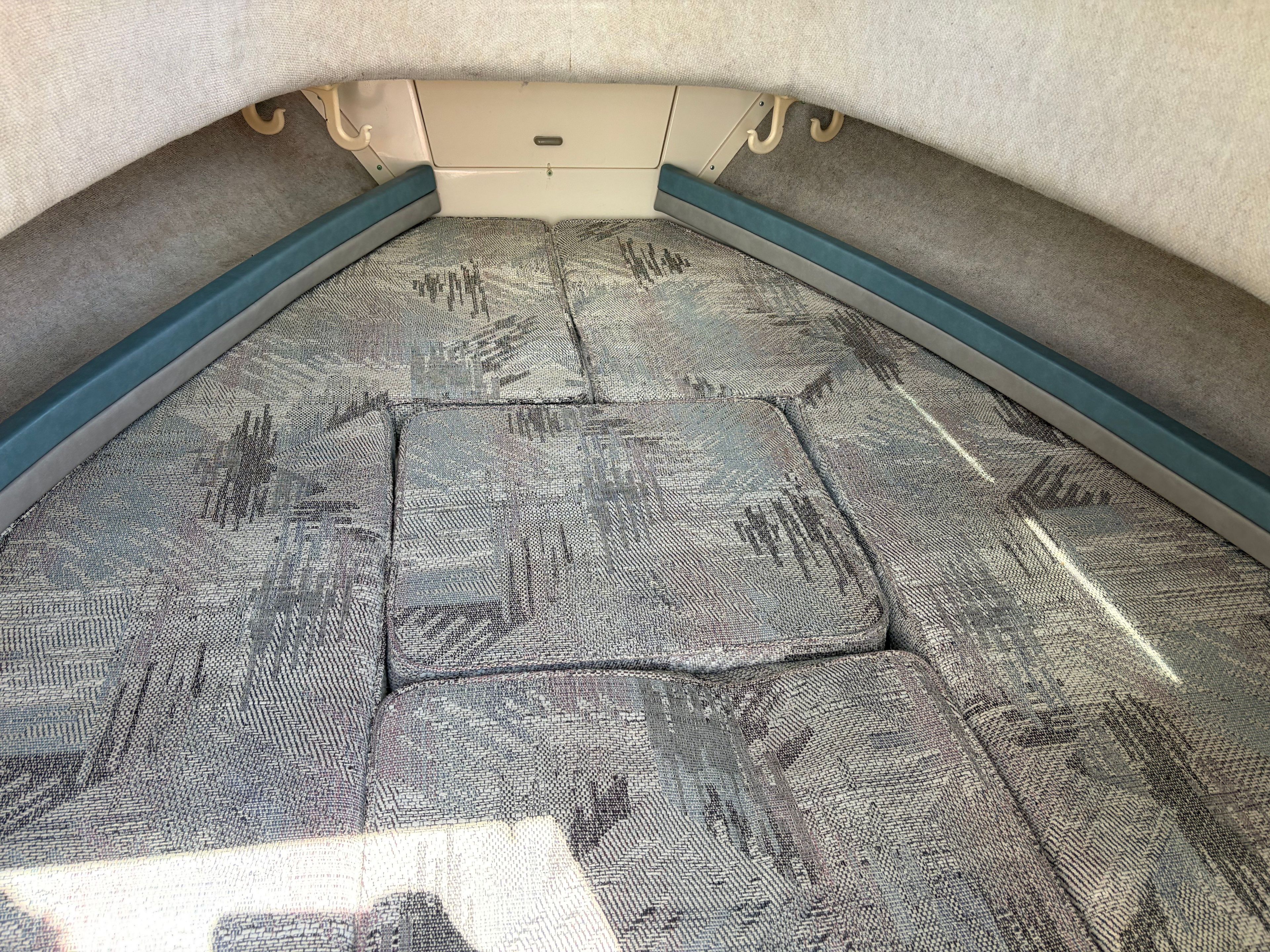 Interior of a 1993 Grady-White Adventure 208 with cushioned seating.
