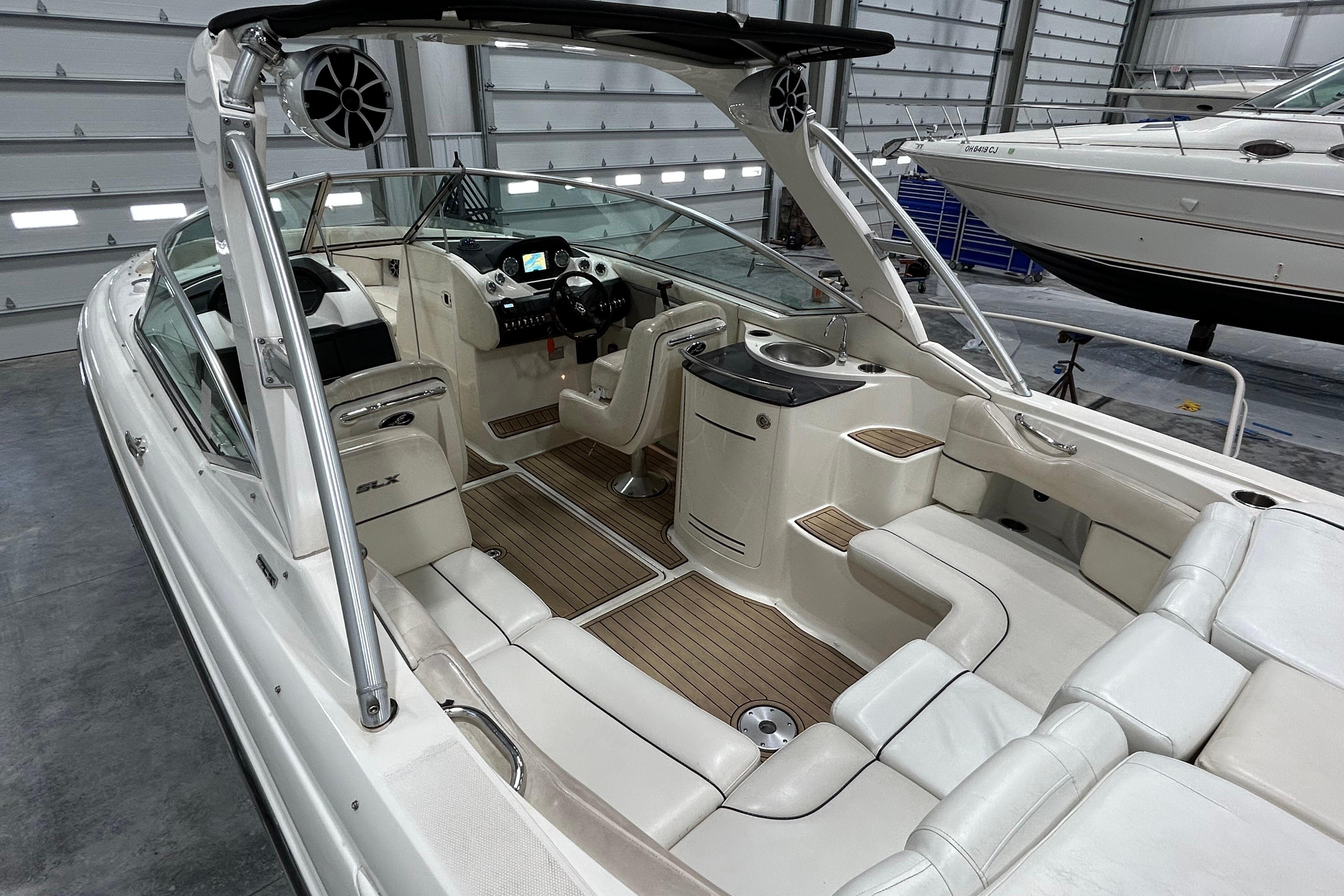 2006 Sea Ray 270 SLX boat interior with luxurious seating and modern dashboard.