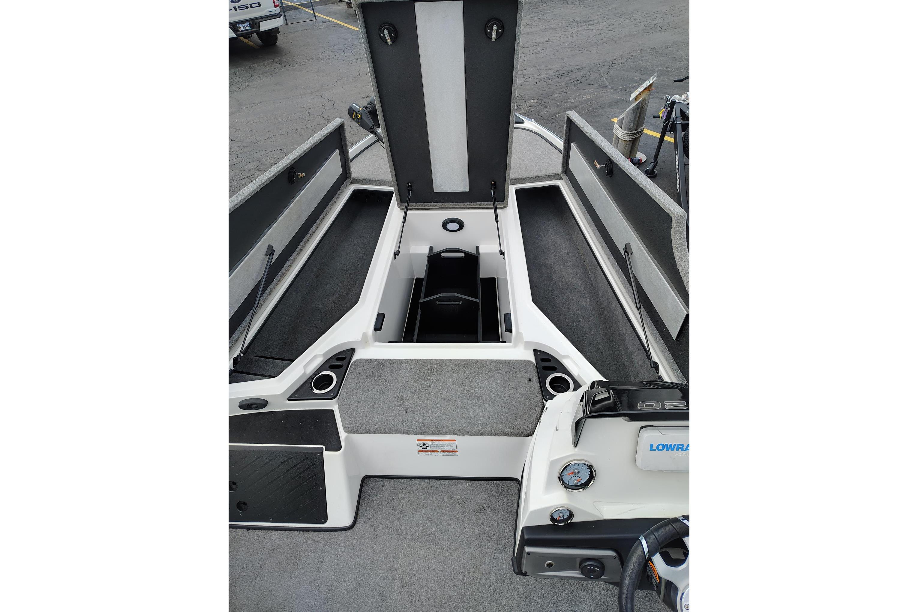 2024 Nitro Z20 boat interior with open storage compartments and control panel.