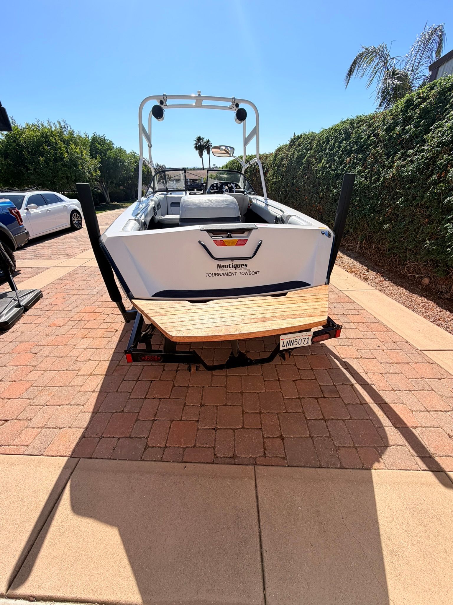 1996 Correct Craft Tournament boat on paved driveway.