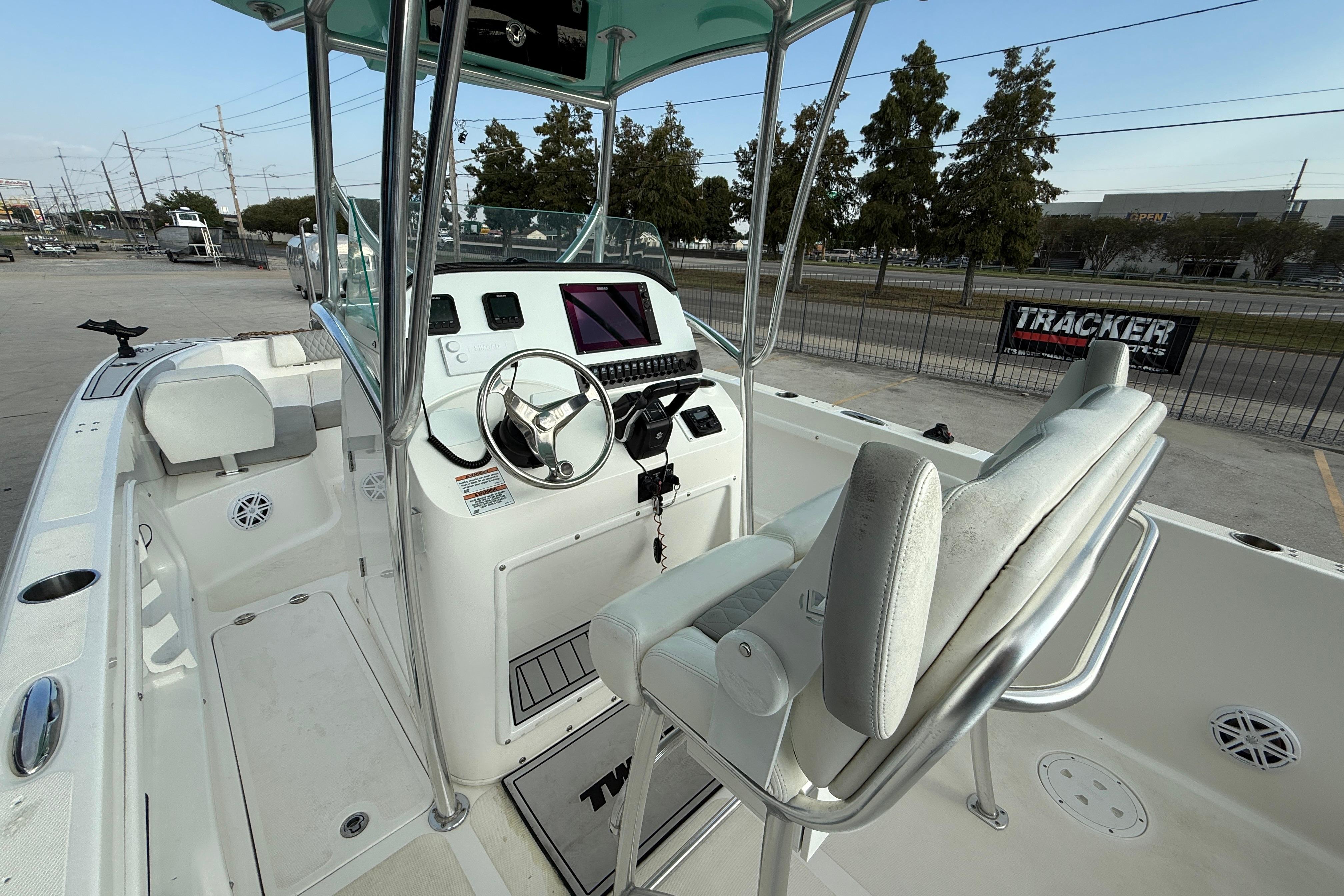 2020 Twin Vee 240 GFX CC boat interior with steering console and seating.