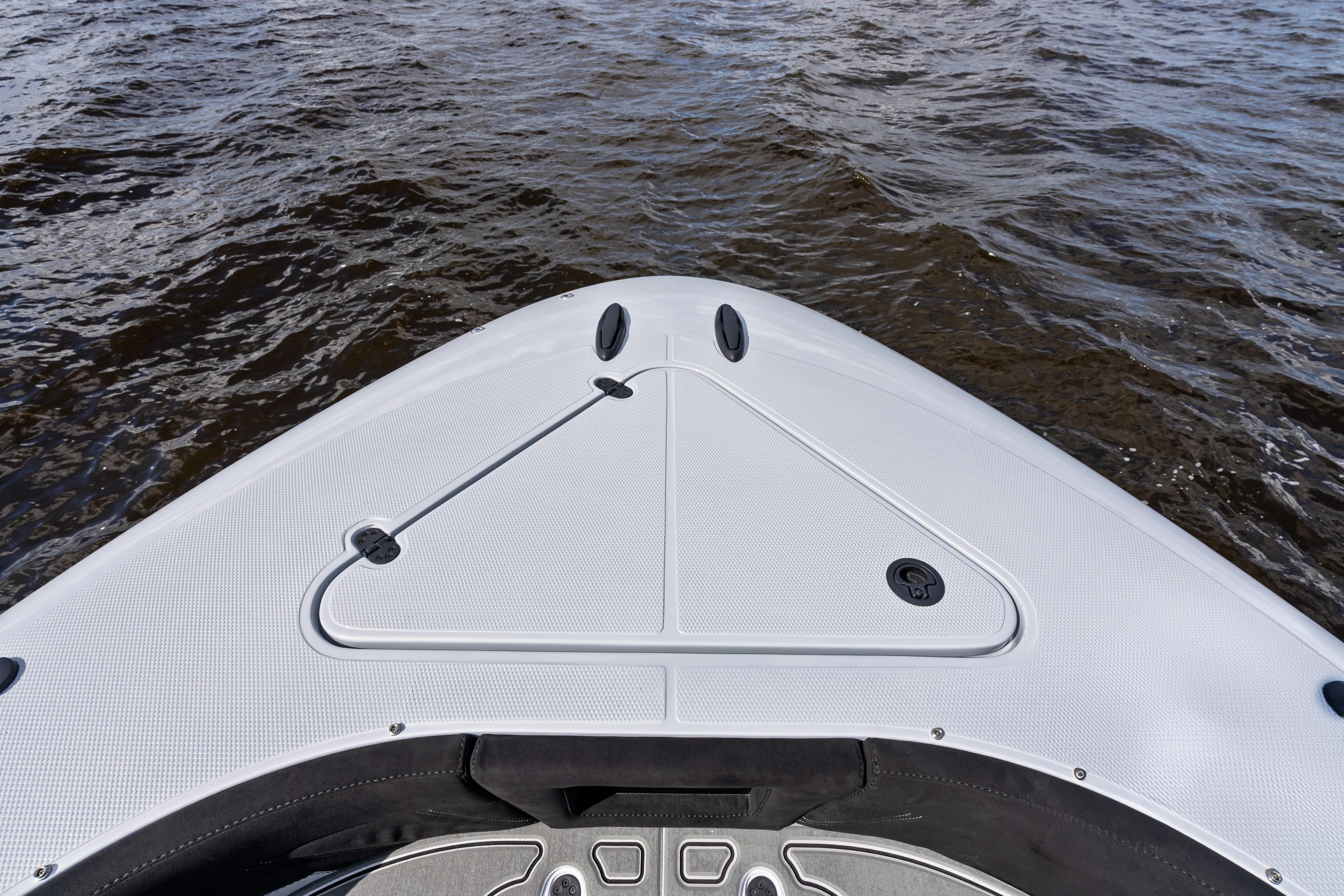 Bow of 2027 Mystic Powerboats M4200 on water, showcasing sleek design and craftsmanship.