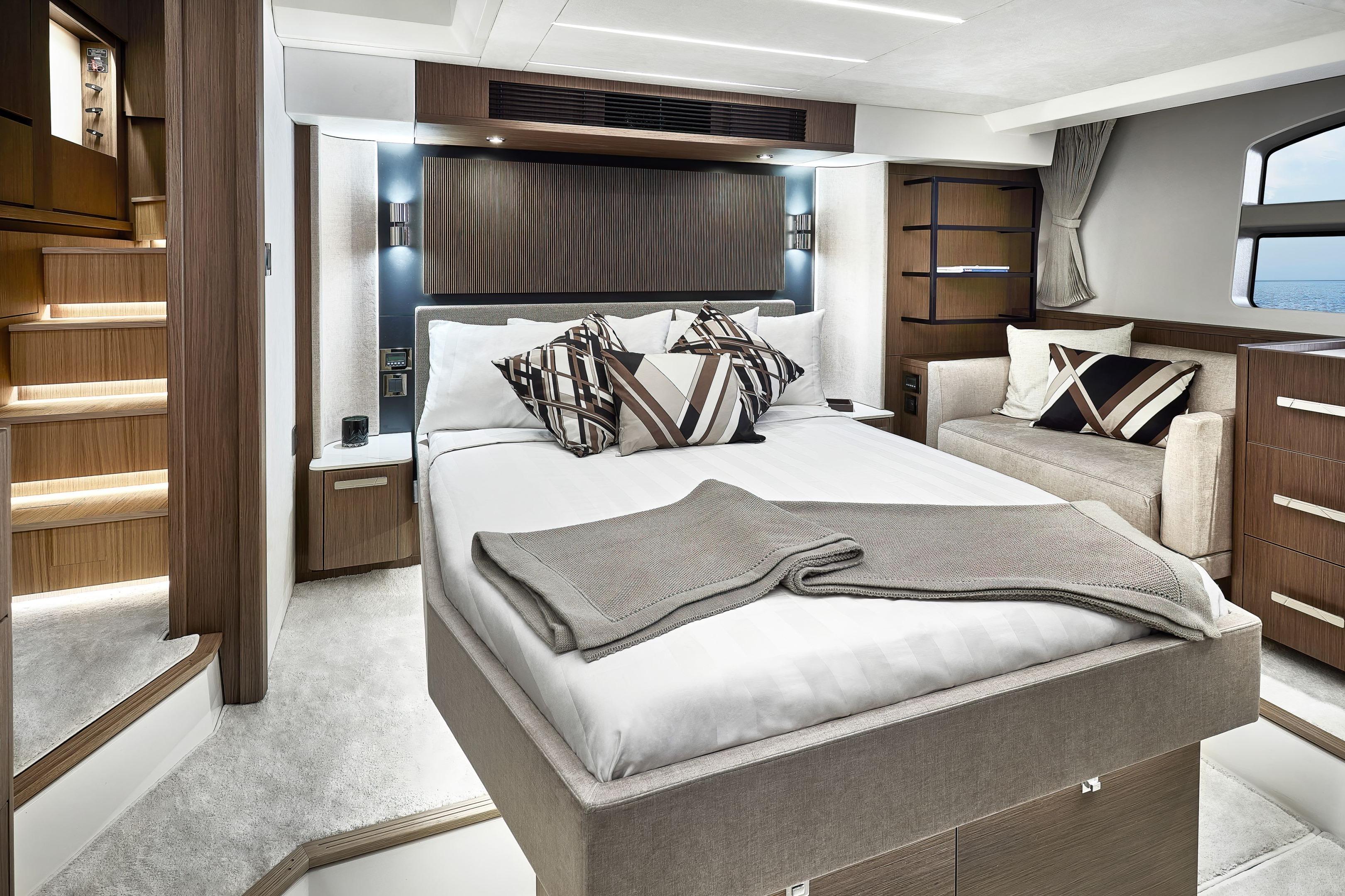 Luxurious 2026 Prestige X60 yacht bedroom with modern design and elegant furnishings.