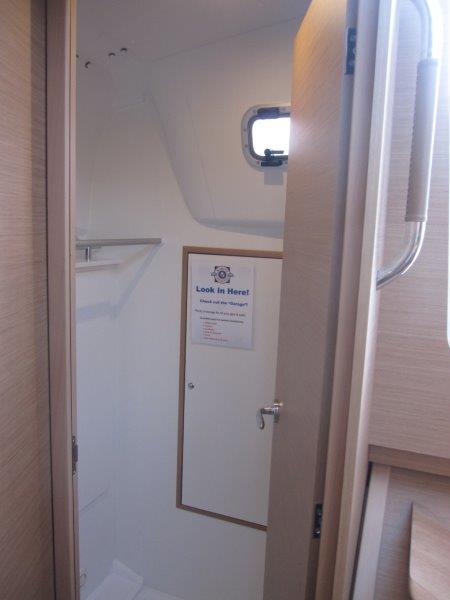 2024 Jeanneau 380 bathroom with window and storage.