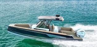 2026 STERK 31 WB Super Sport boat cruising on clear blue water.