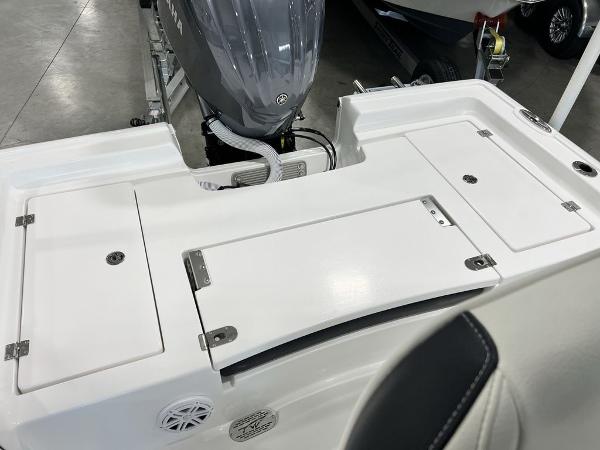 2025 Tidewater 2300 Carolina Bay boat deck with storage compartments and motor.