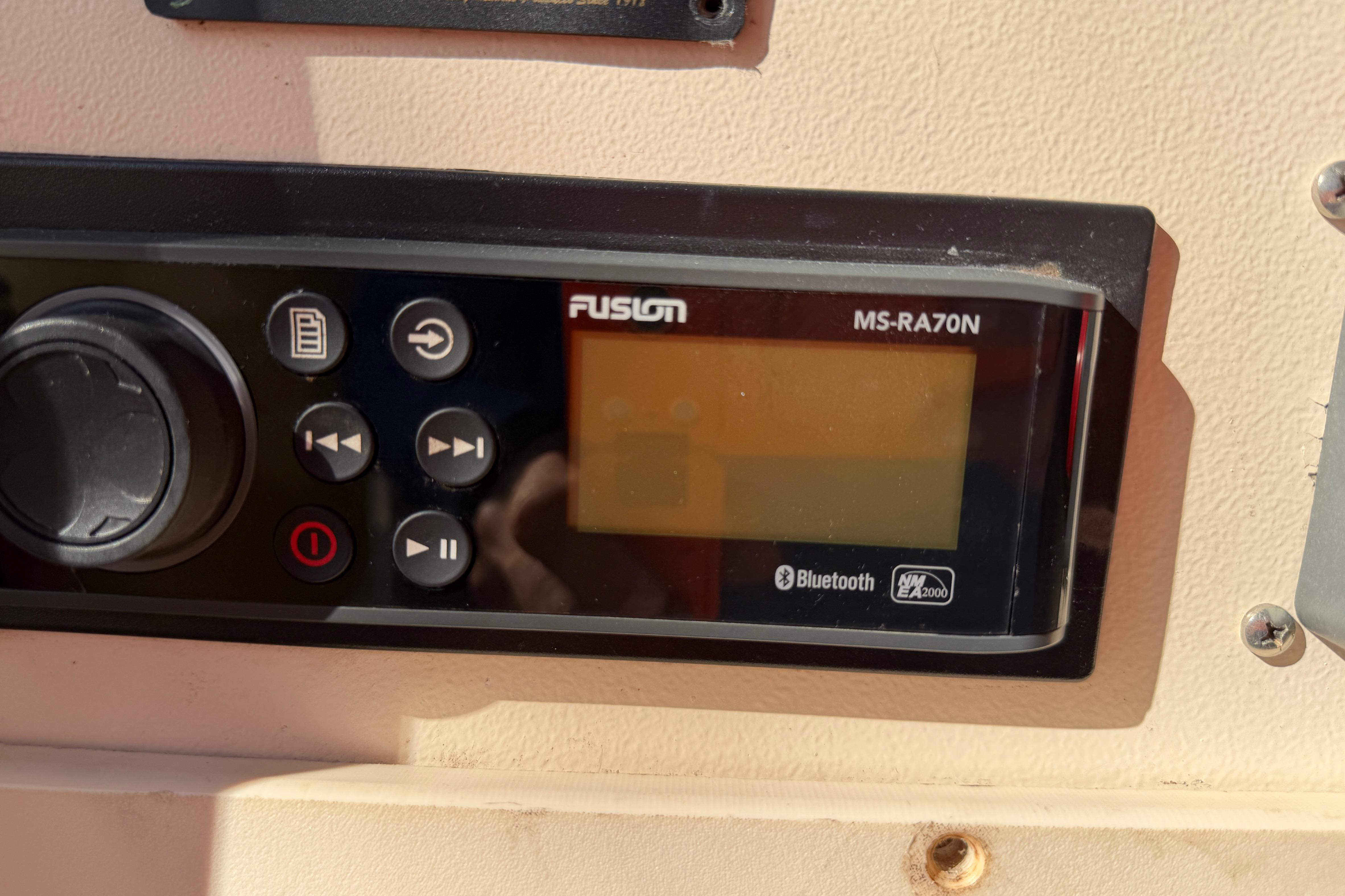 Fusion MS-RA70N stereo system on 2004 Grady White 273 boat dashboard.