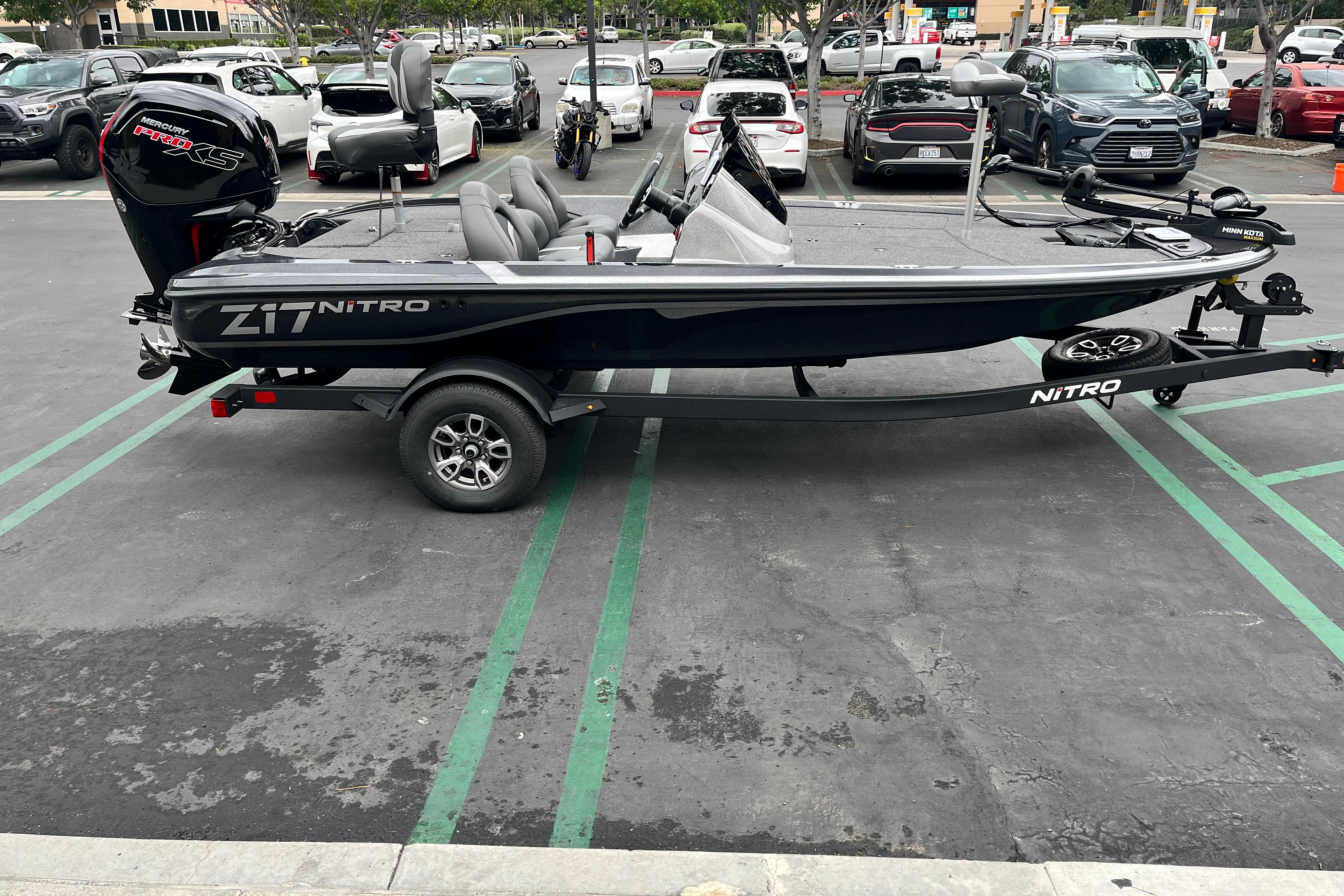2026 Nitro Z17 boat with Mercury Pro XS engine in parking lot.