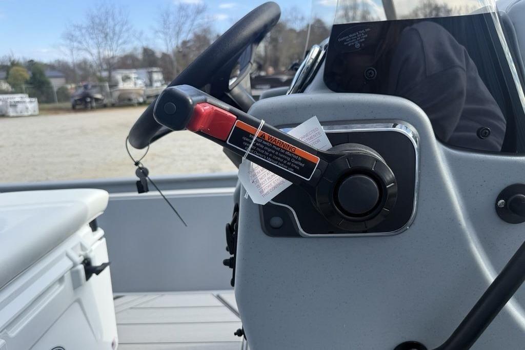 2026 Tracker Bass Tracker Classic CC steering console with warning label.
