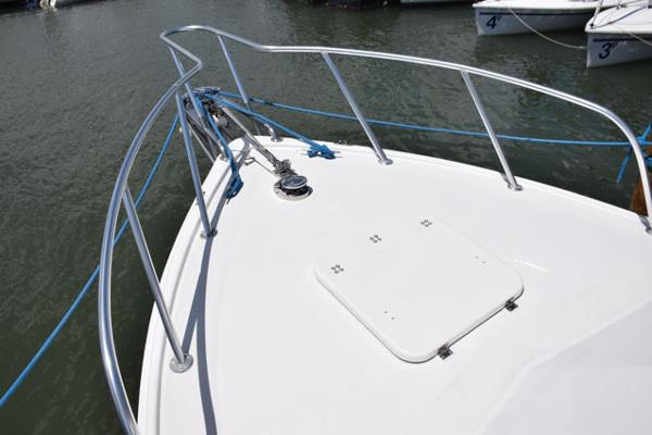 Aluminum bow rail and solid fiberglass deck hatch