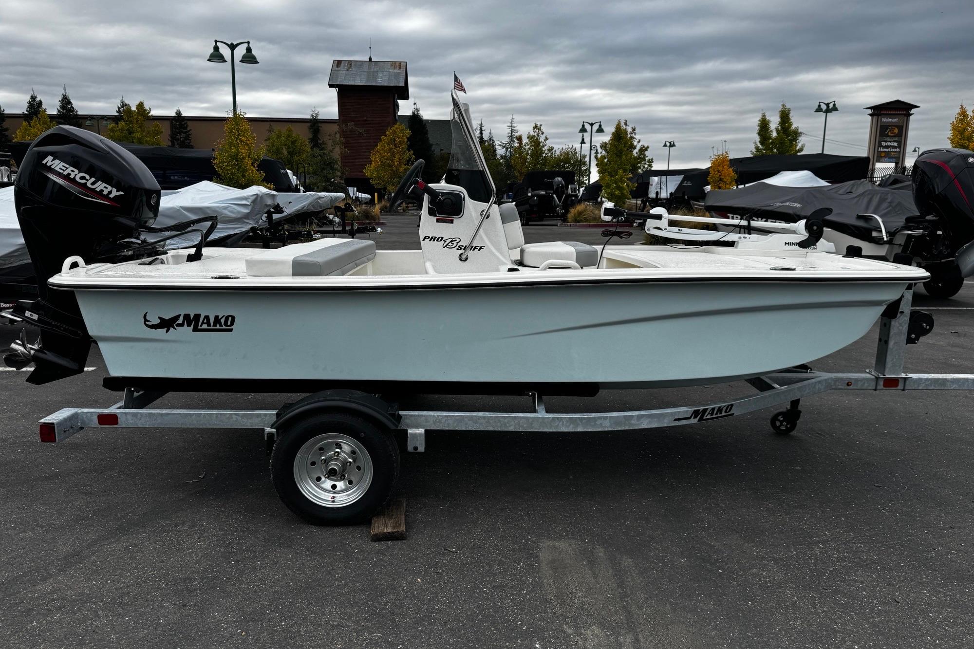 2026 Mako Pro Skiff 13 CC boat on trailer, outdoor display.