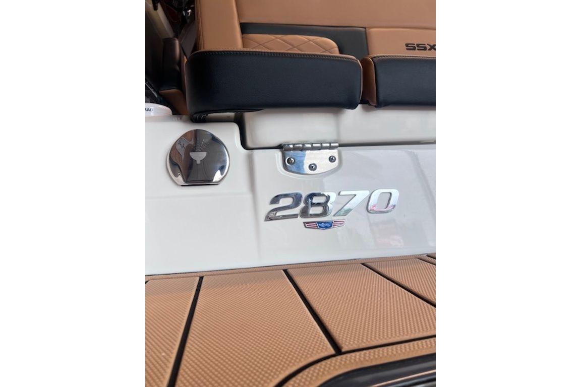 2025 Chaparral 2870 SSX boat interior with logo and seating detail.