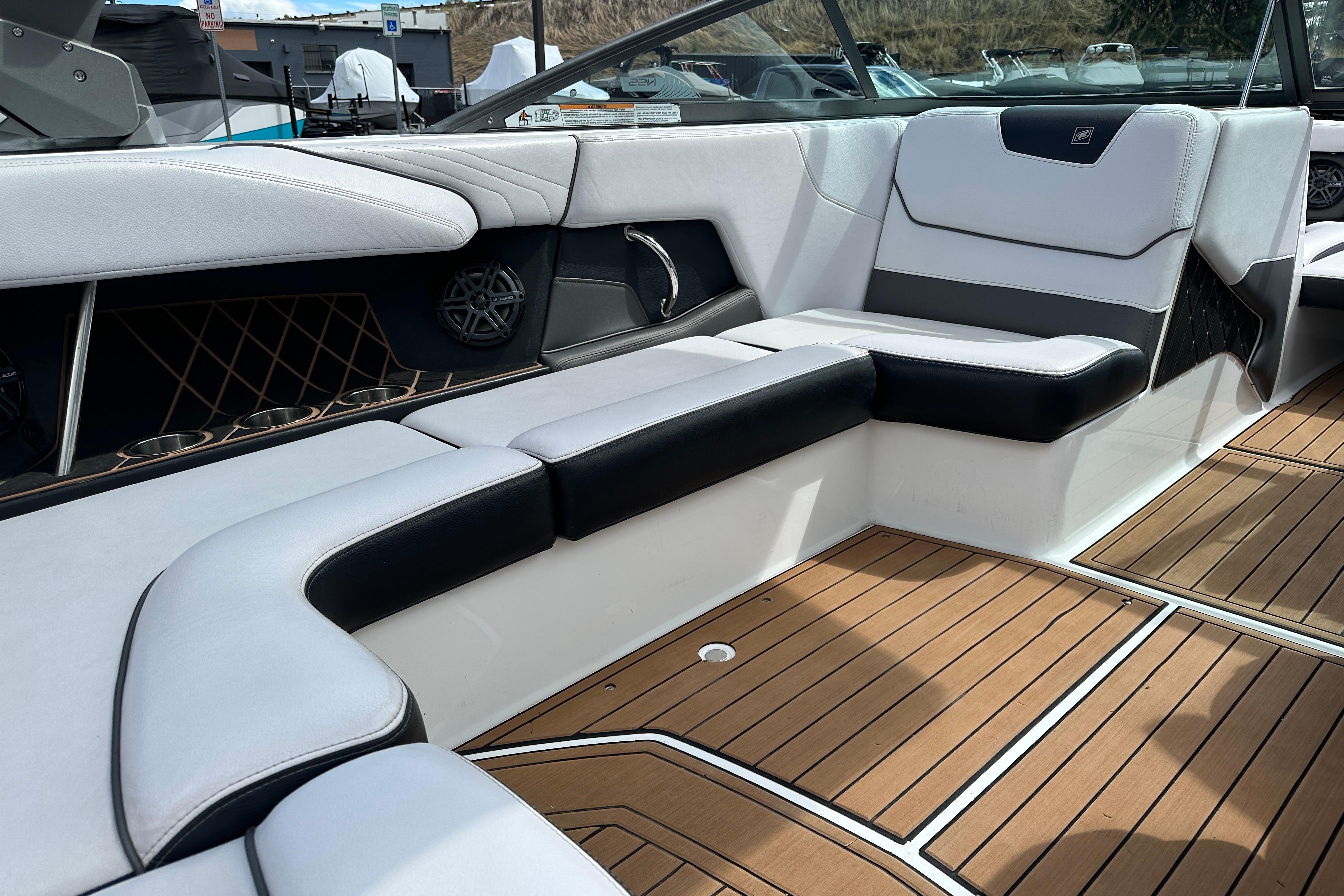 2017 Nautique Super Air Nautique GS20 interior with sleek seating and teak flooring.