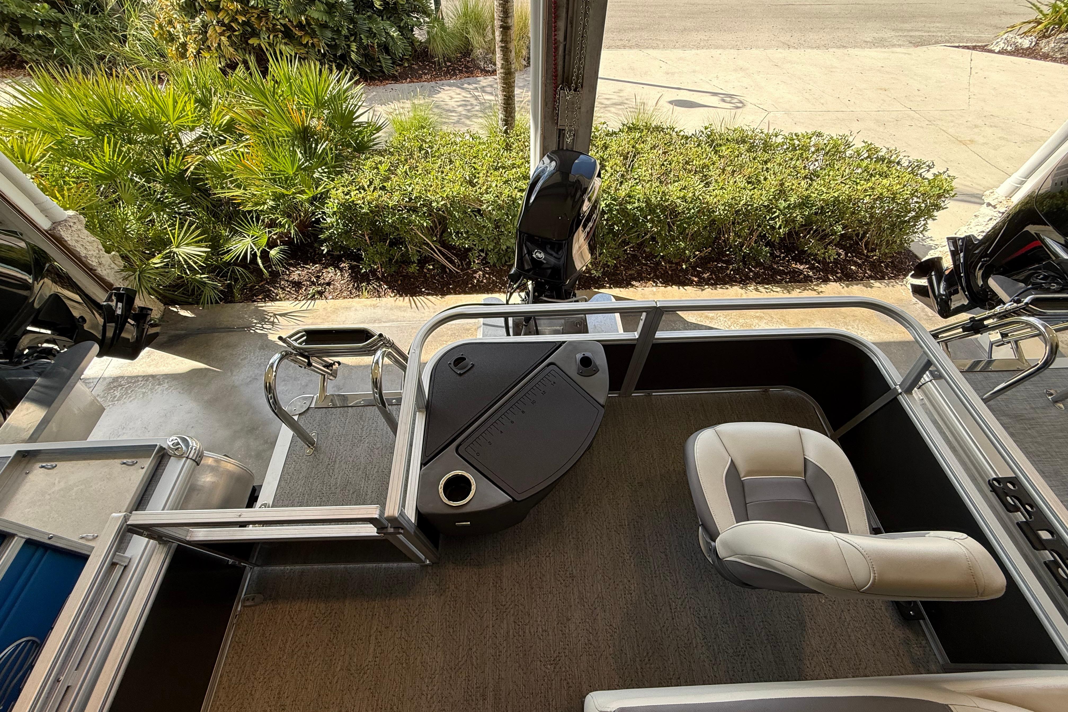 2026 Sun Tracker Bass Buggy 18 DLX interior with seating and control panel.