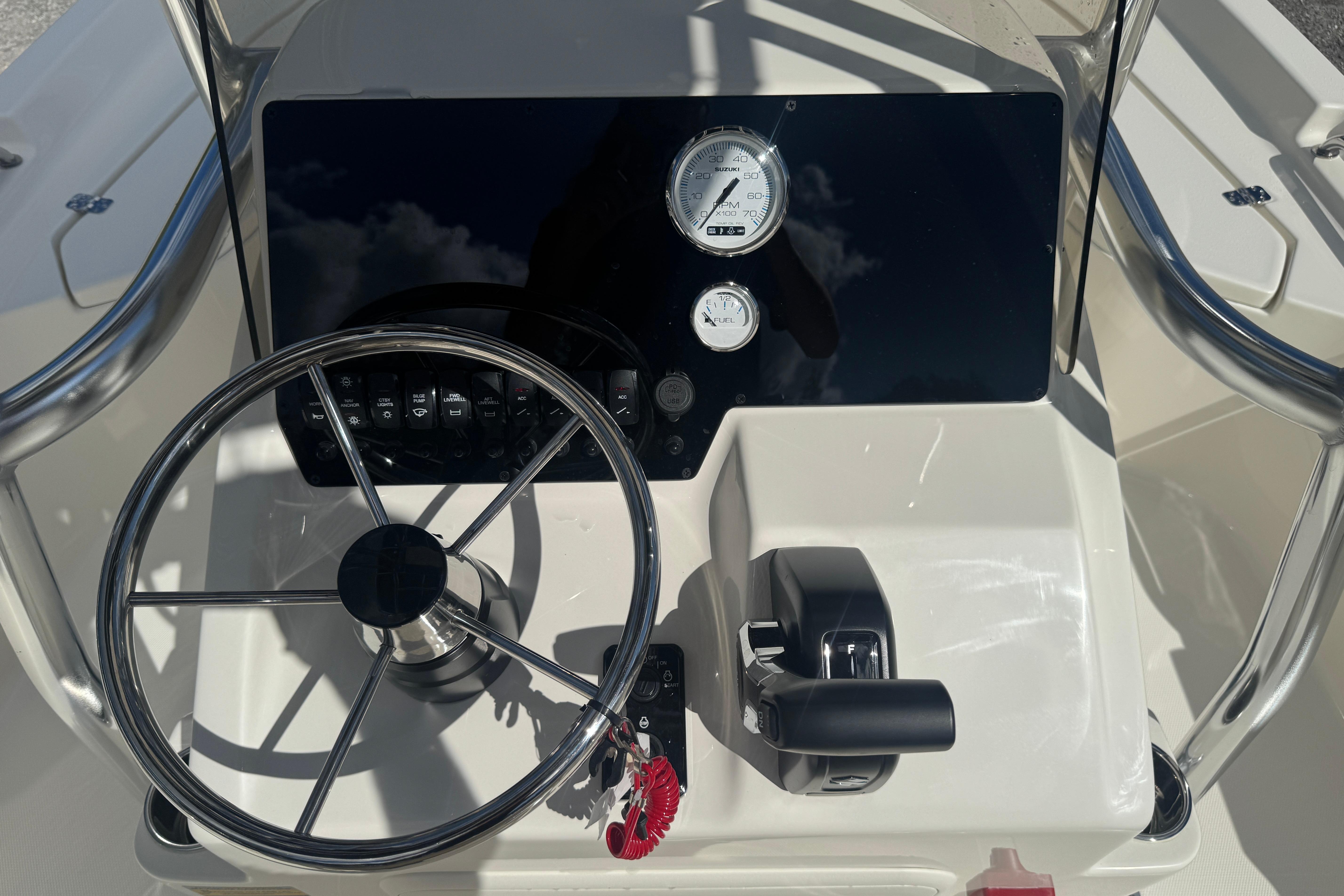 Steering console of 2026 Bulls Bay 2200 boat with gauges and controls.