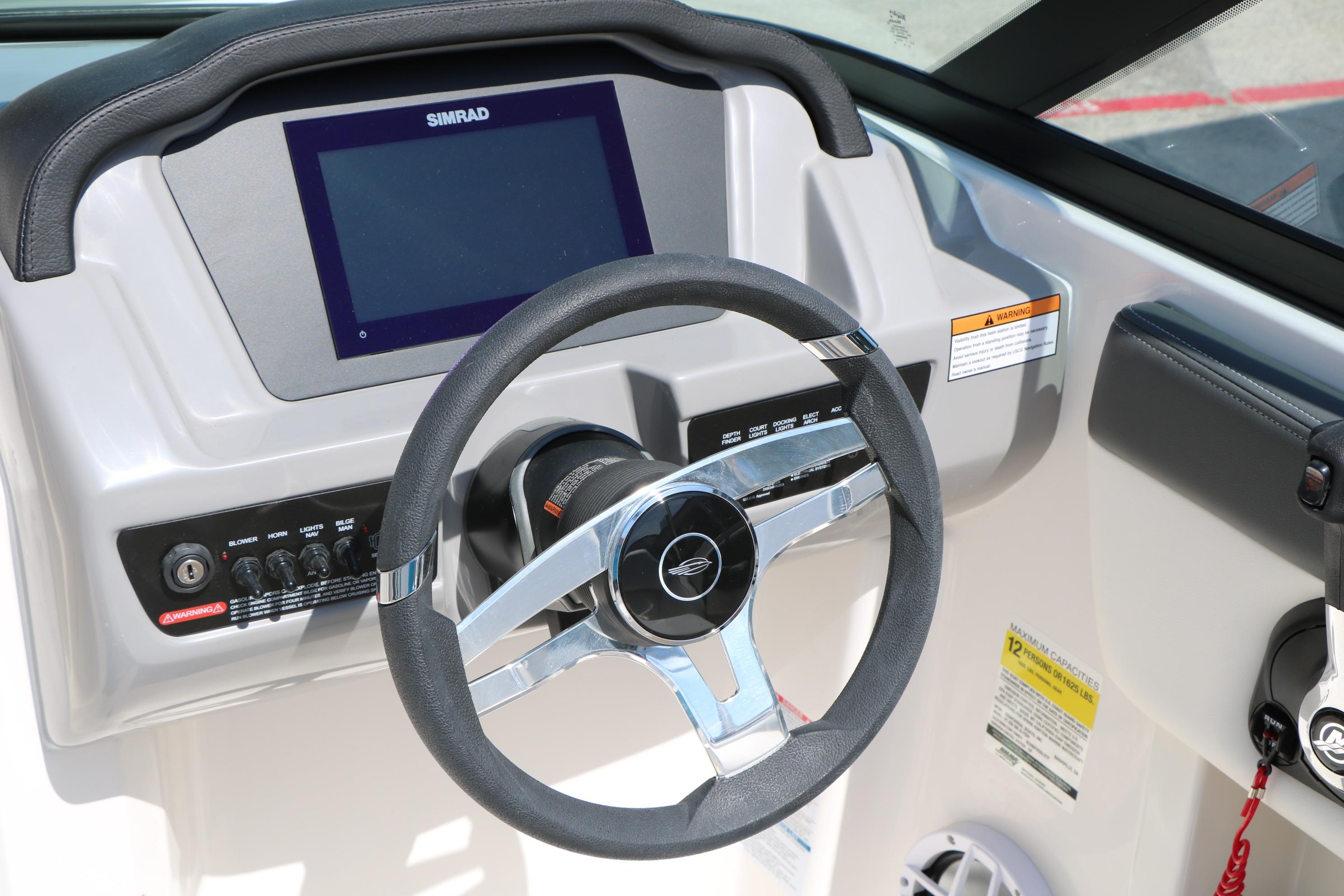 Steering wheel and dashboard of 2025 Chaparral 21 SSi Ski & Fish boat.
