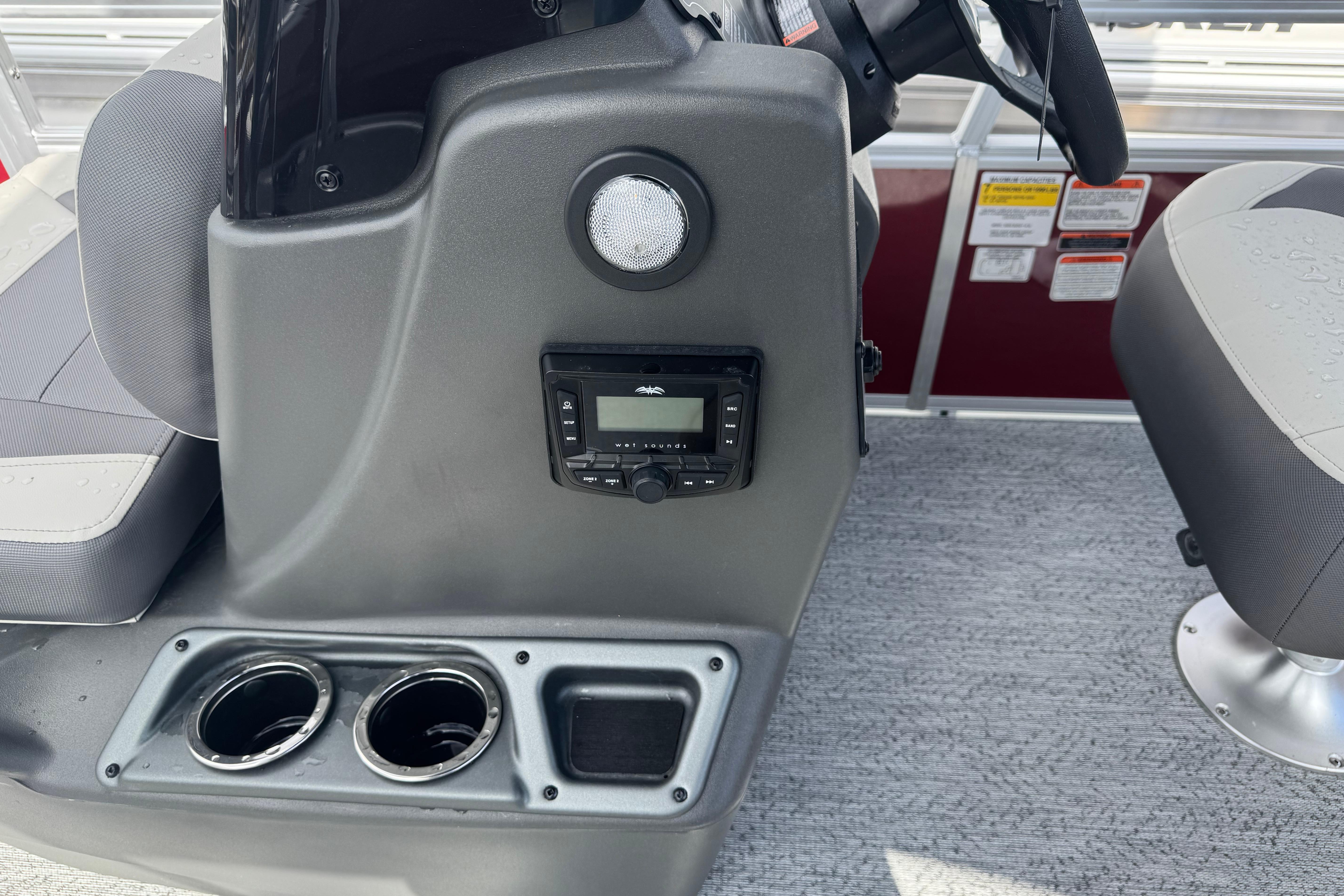 2026 Sun Tracker Bass Buggy 16 XL Select console with cup holders and audio controls.
