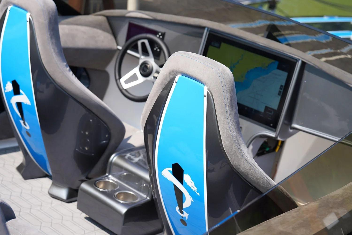Manufacturer Provided Image: Interior of 2026 Statement 360 CAT boat with modern dashboard and blue-accented seats.