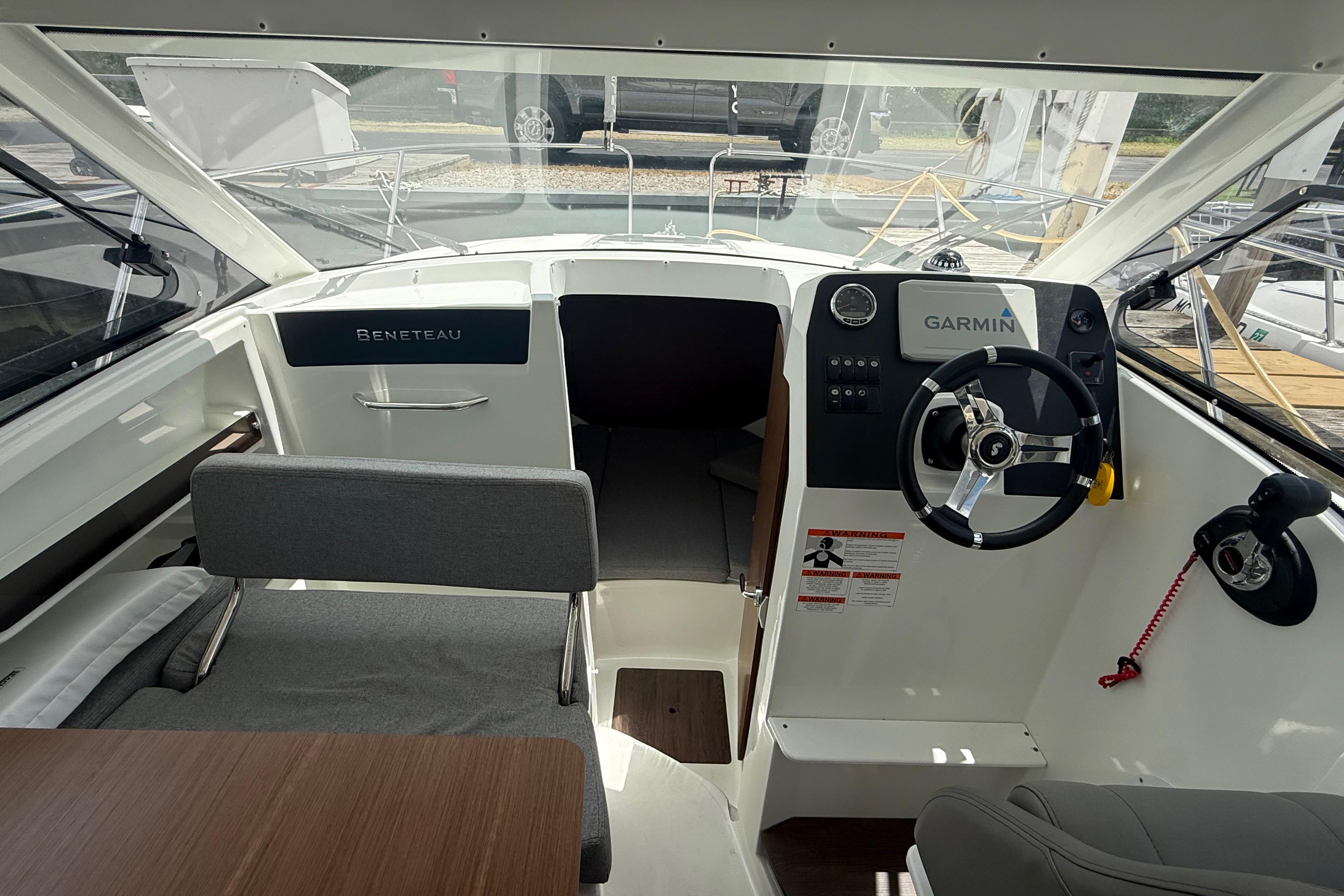 Interior view of a 2019 Beneteau Antares 23 boat with Garmin navigation system.