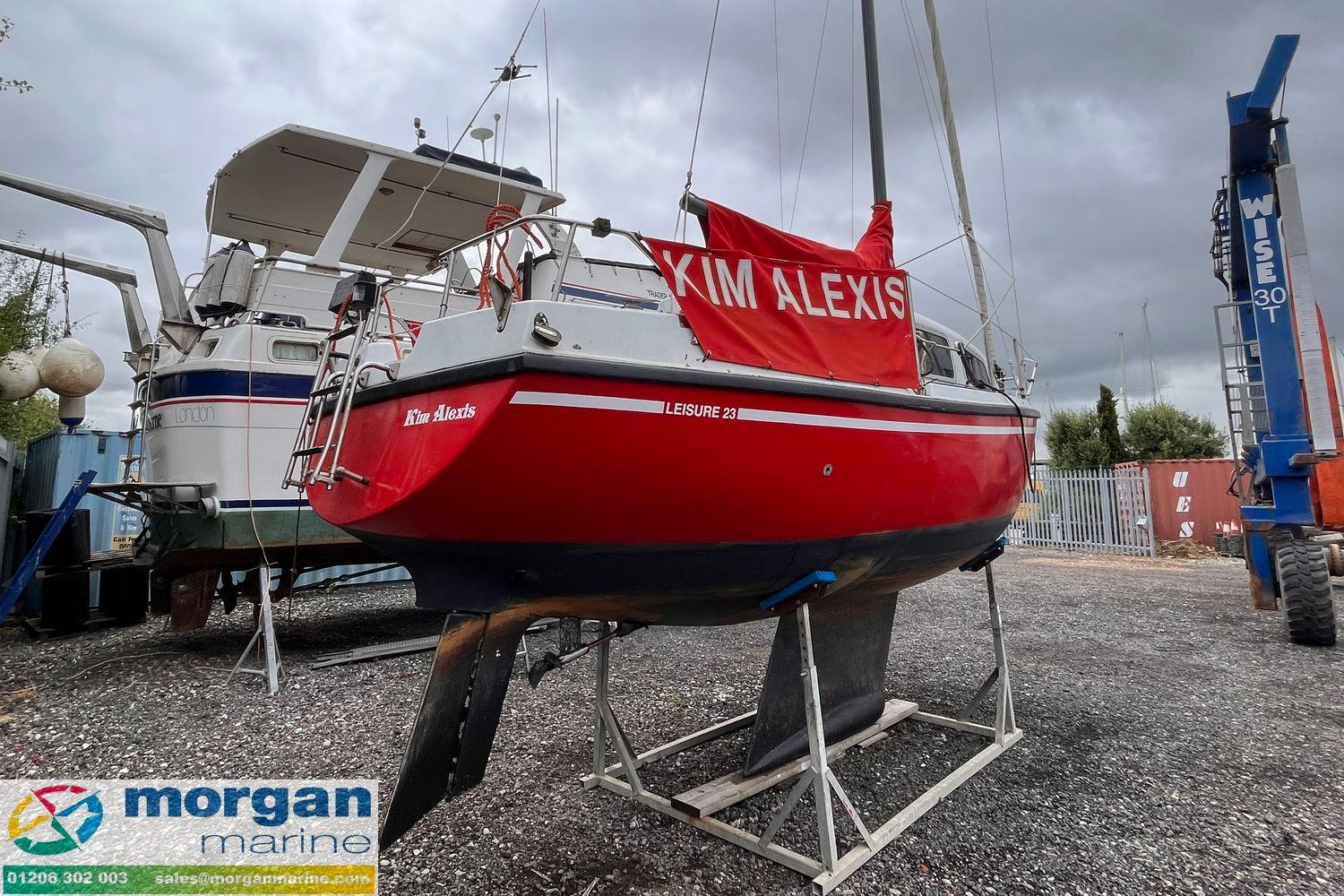 Red 1979 Leisure 23 sailboat named "Kim Alexis" on display at Morgan Marine.