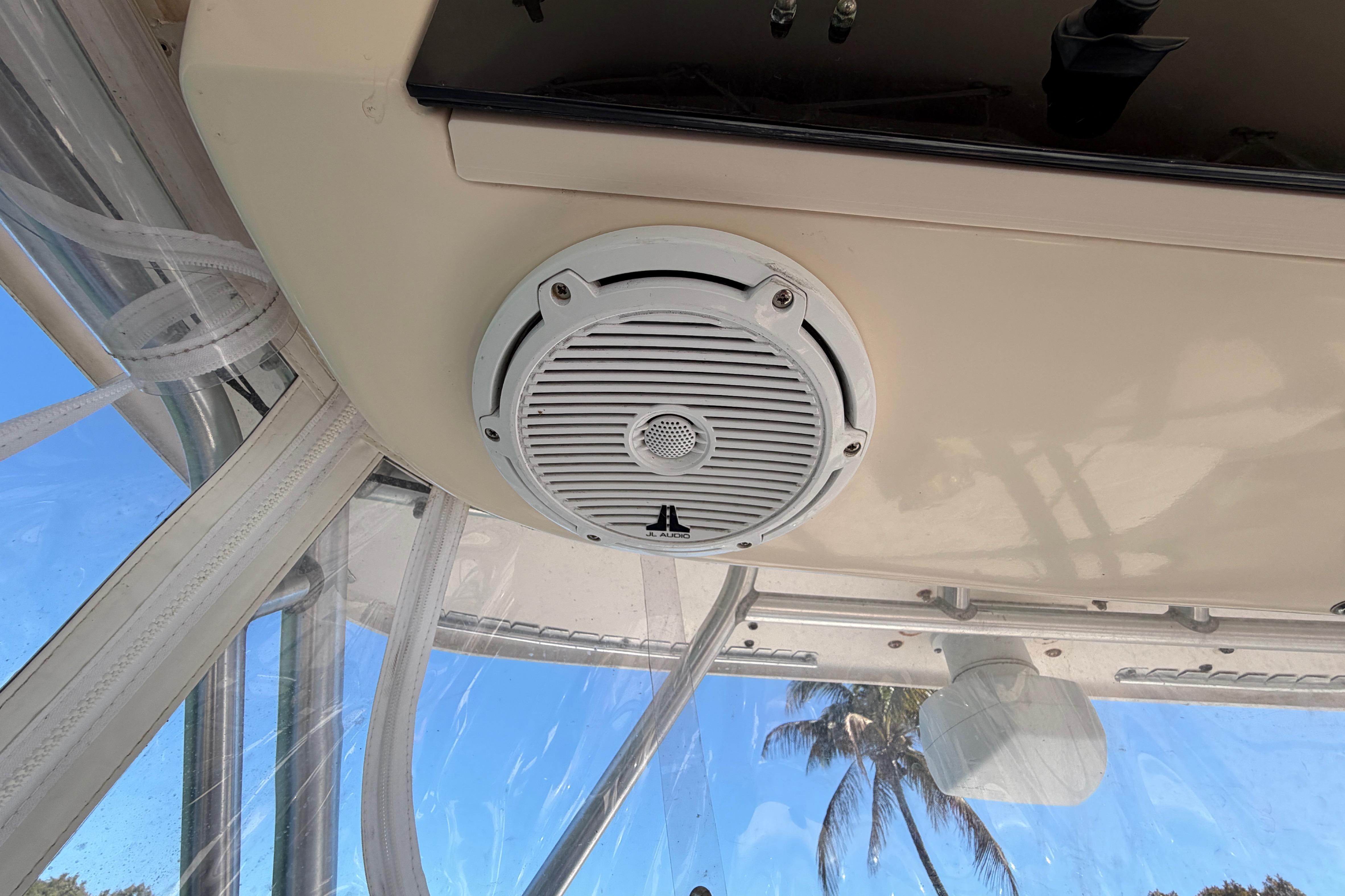 2006 Grady-White Sailfish 282 boat interior with speaker and clear canopy view.