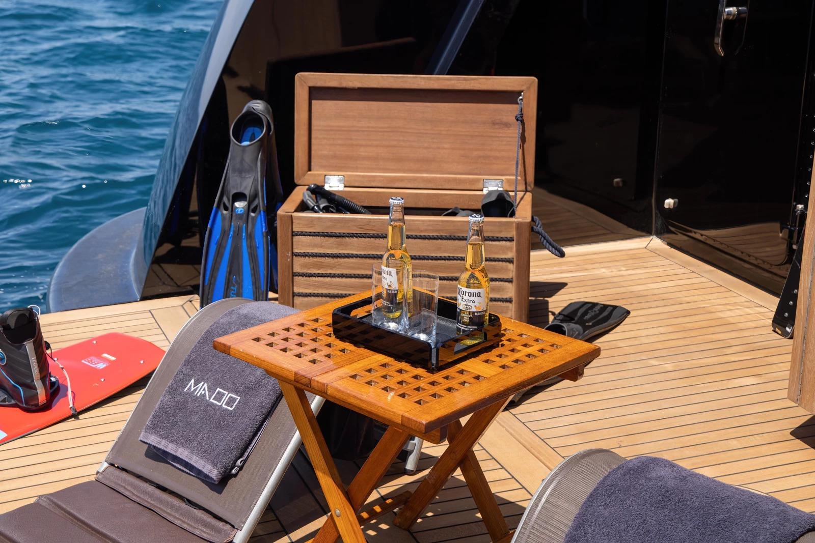 Luxury yacht deck with drinks, diving gear, and sun loungers, Admiral 2009 model.