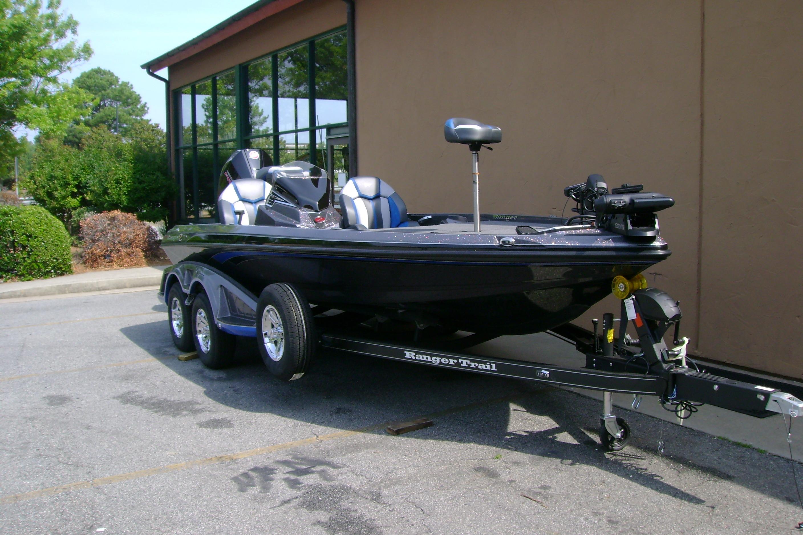 2026 Ranger Z519R Cup-Equipped boat on trailer, parked outdoors.
