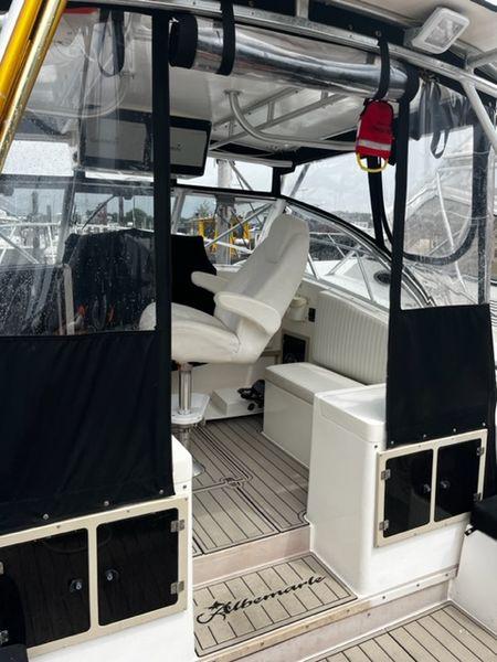 1996 Albemarle 305 boat interior with seating and helm, featuring sleek design and modern amenities.