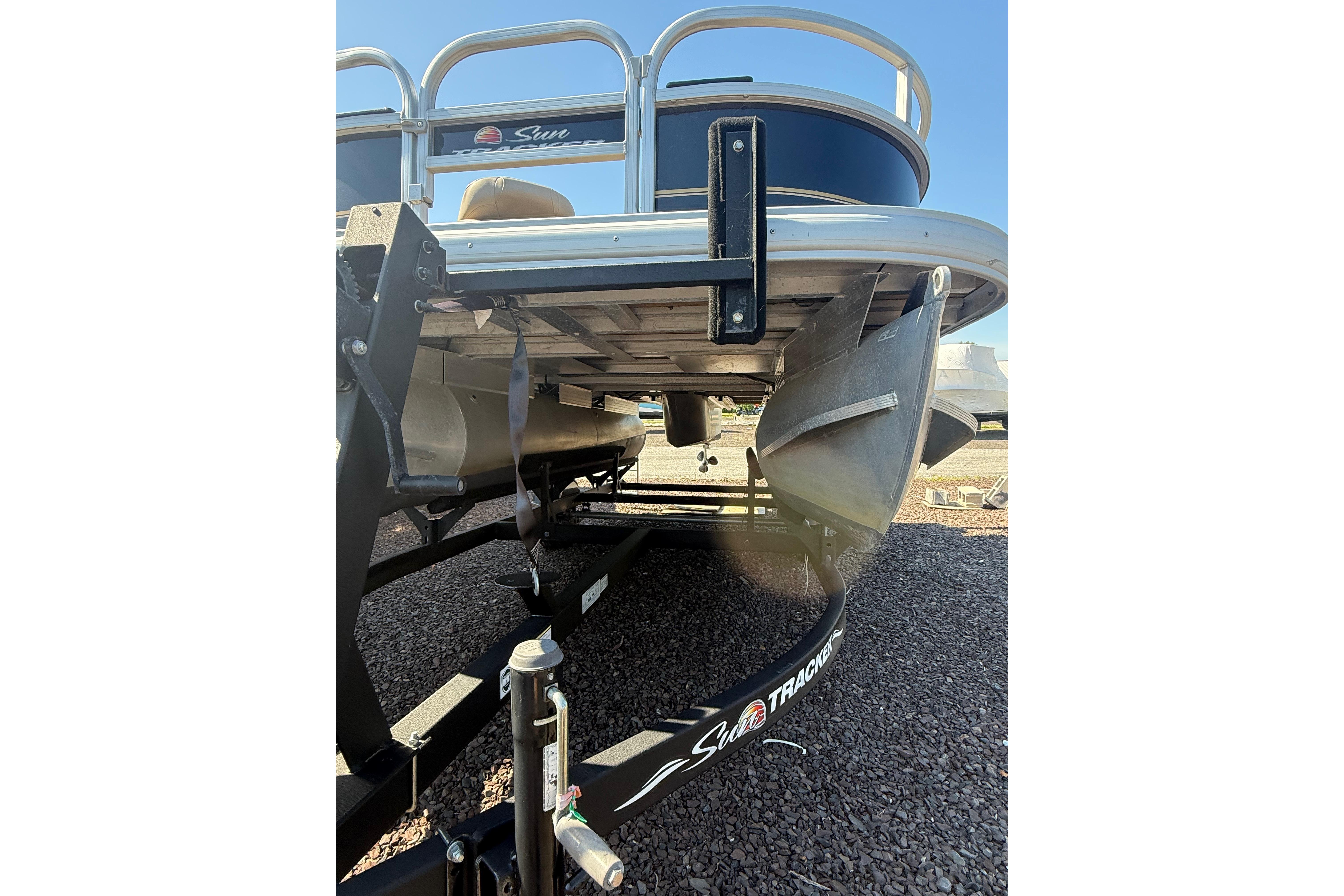 2021 Sun Tracker Bass Buggy 16 XL Select pontoon boat on trailer, rear view.
