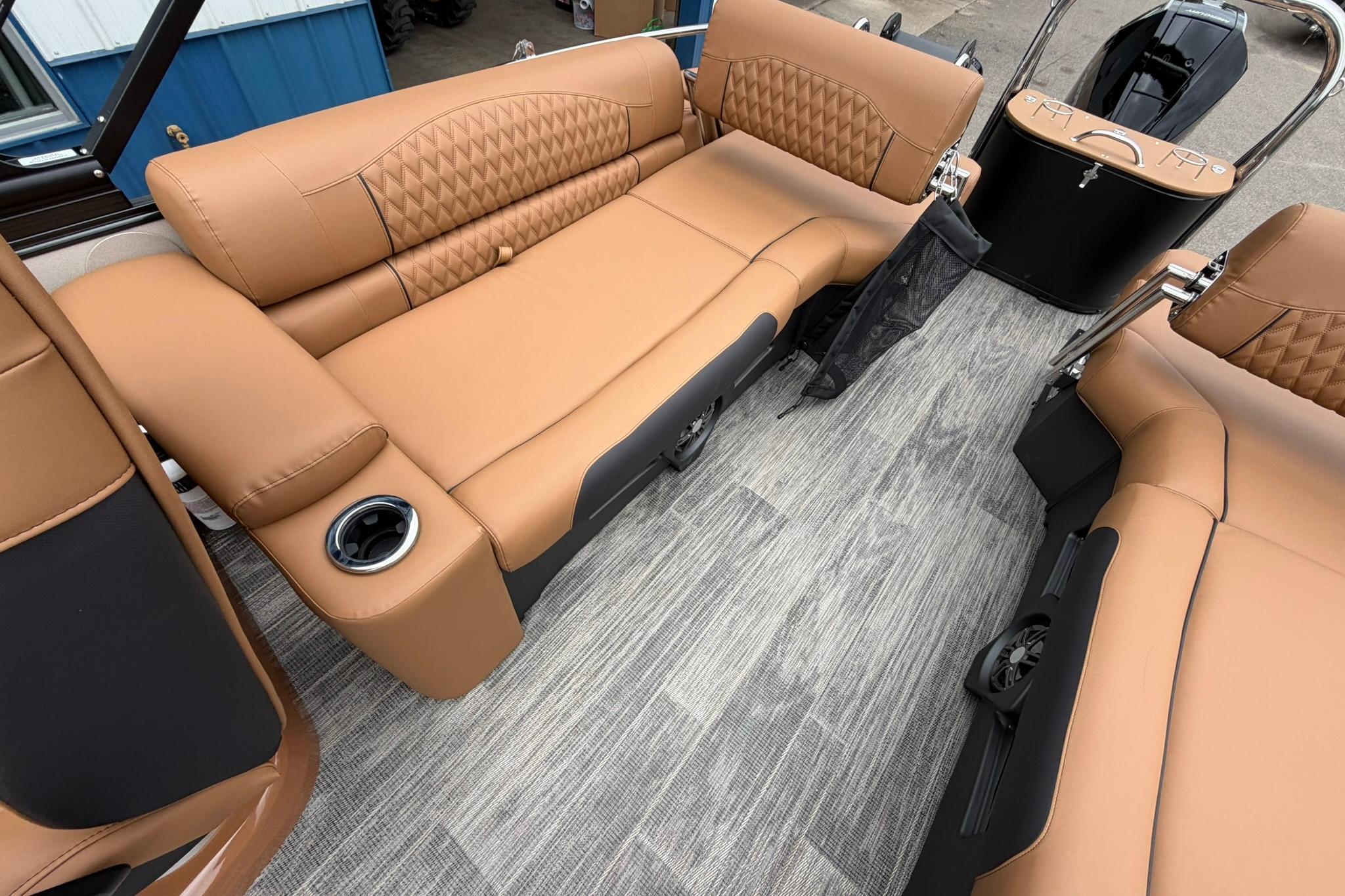 Luxurious interior of 2026 Avalon Catalina Quad Lounge Shift boat with tan seating and modern design.