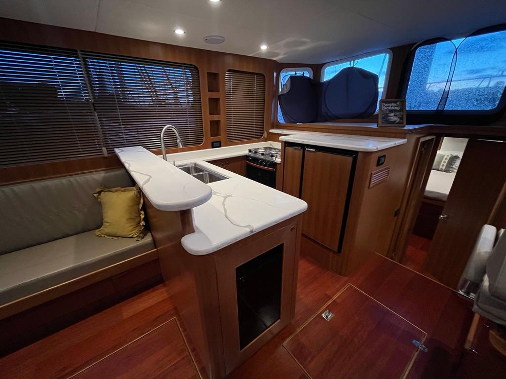 Modern Bracewell 41 yacht interior with kitchen and seating area, 2025 model.
