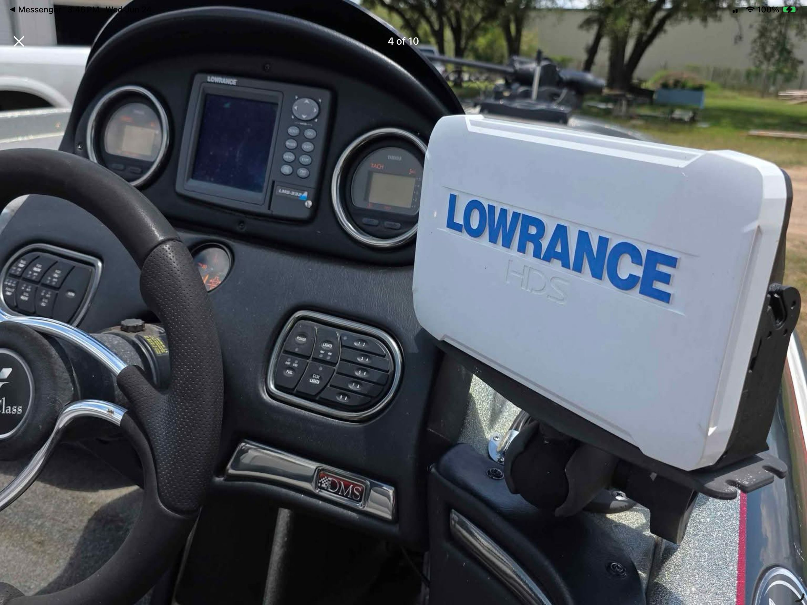 The image shows the cockpit of a 2006 Skeeter 20i boat with a Lowrance HDS device.