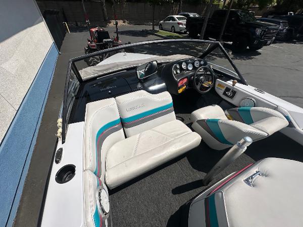1992 Correct Craft Ski Nautique interior with white seats and colorful accents.