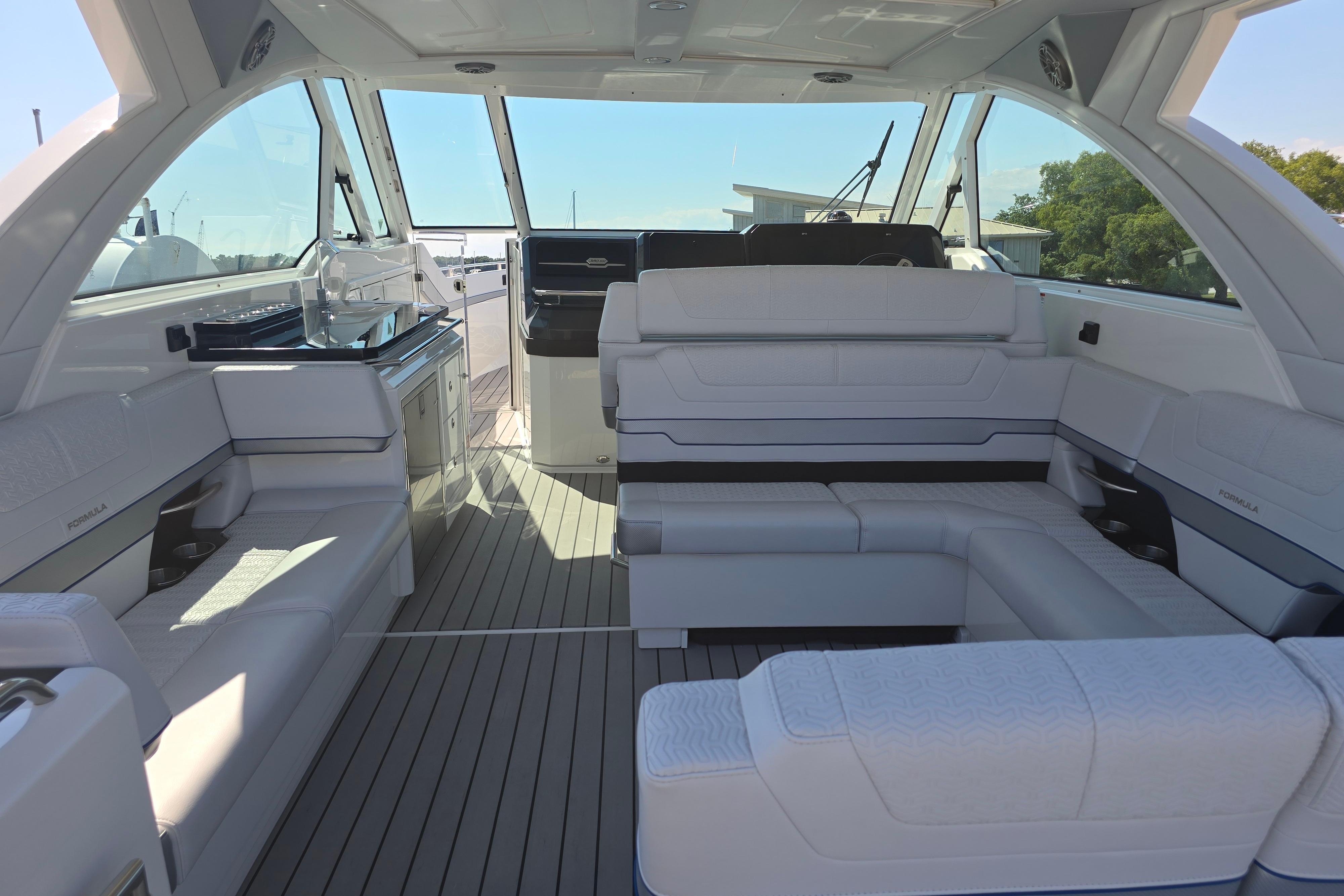 Luxurious interior of 2025 Formula 380 Super Sport Crossover OB boat with plush seating.