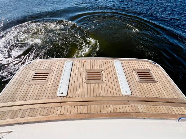 2025 Sabre 43 Salon Express yacht deck on calm water.