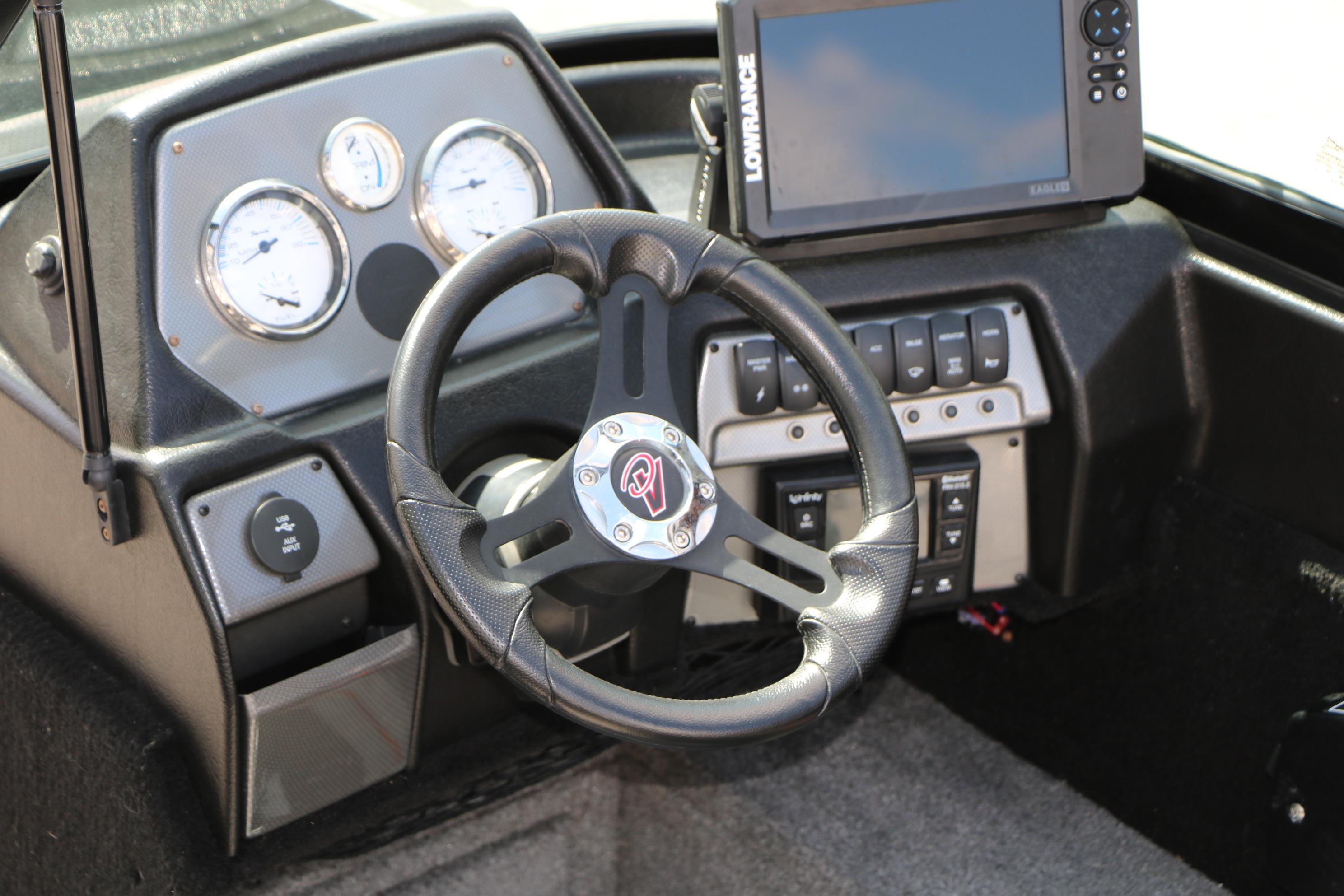 Dashboard of 2023 Alumacraft Competitor FSX 185 with steering wheel and navigation system.