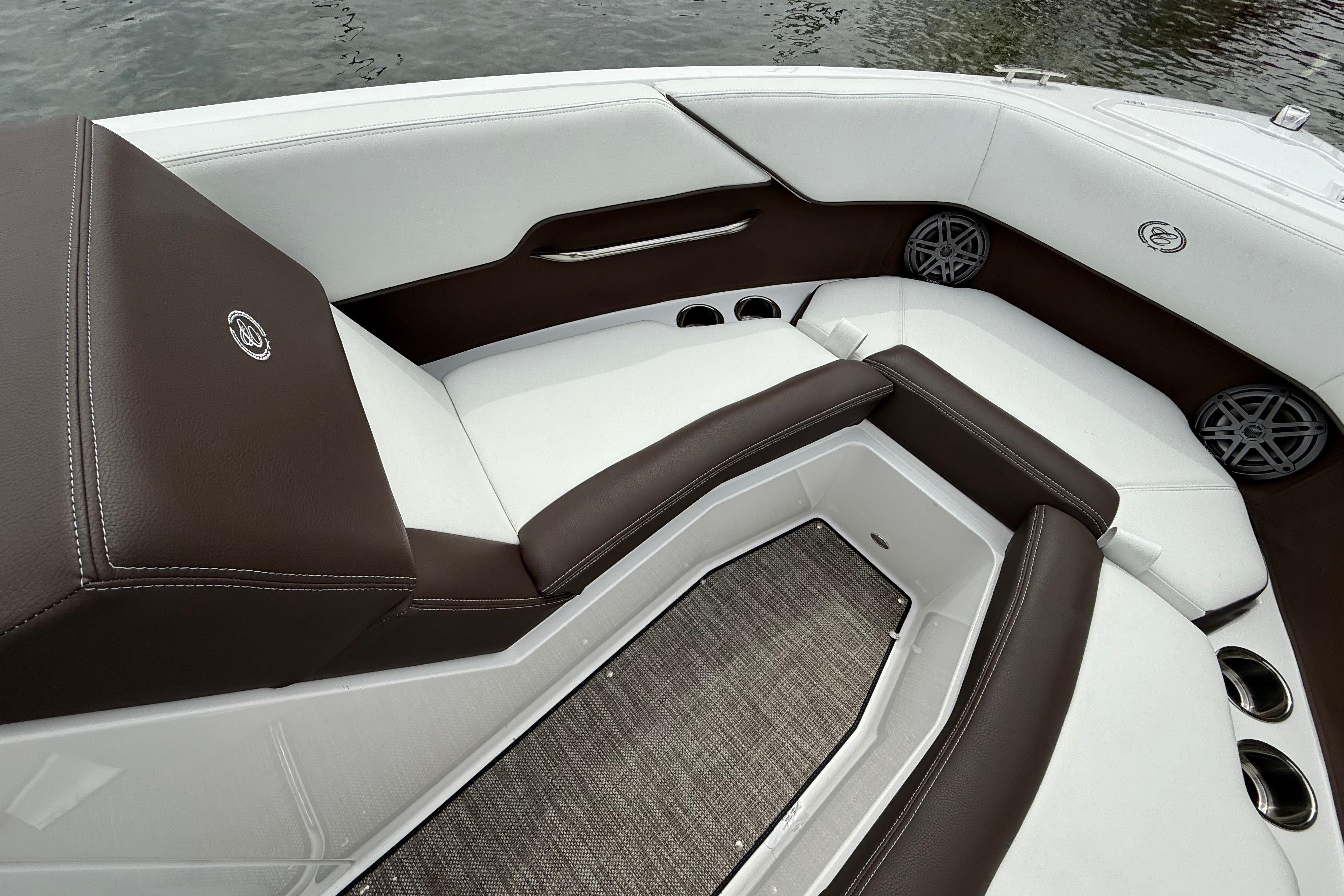 Luxurious interior of 2025 Cobalt CS23 boat with brown and white seating.