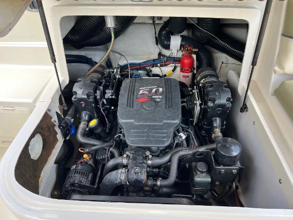 Engine compartment of a 2005 Sea Ray 220 Sundeck boat, featuring a 5.0 MPI engine.