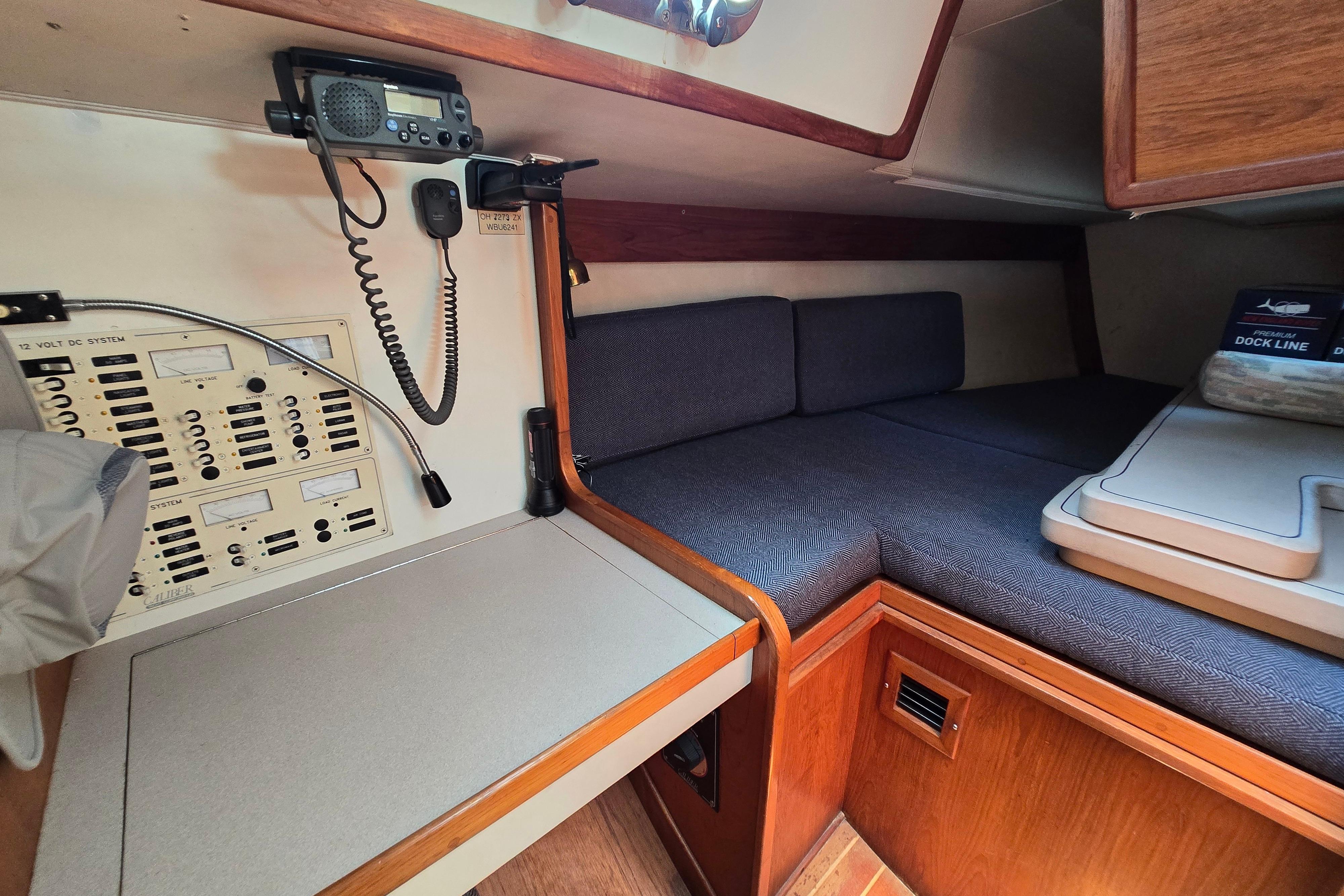 1993 Caliber 35 yacht interior with navigation equipment and cozy sleeping area.