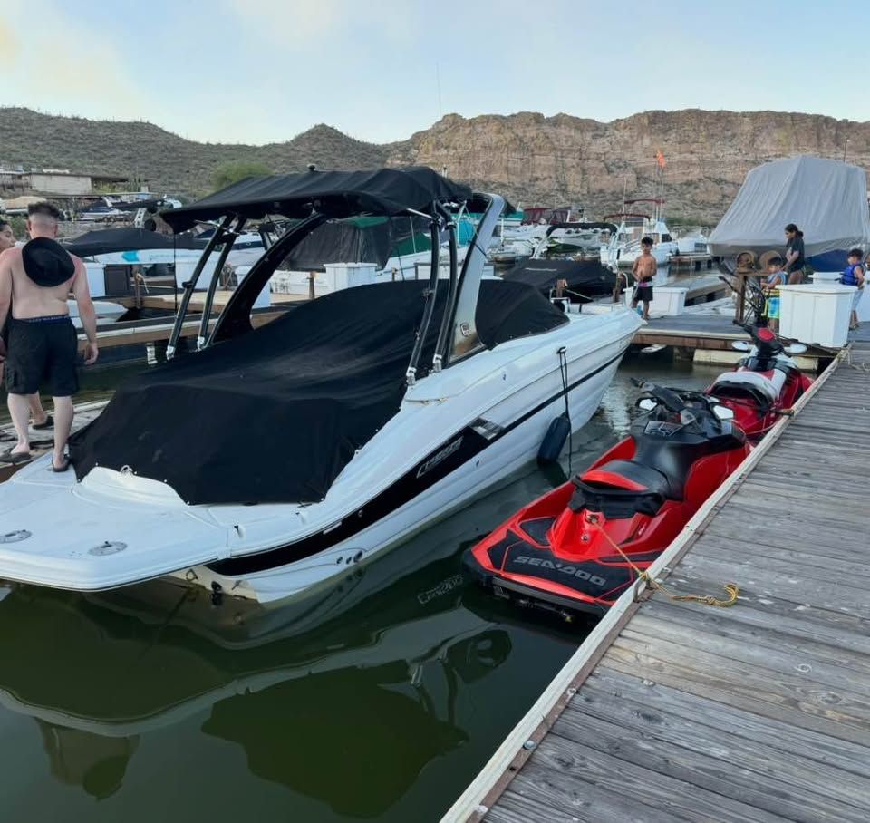 2016 Cruisers Sport Series 29SS boat docked with jet ski.