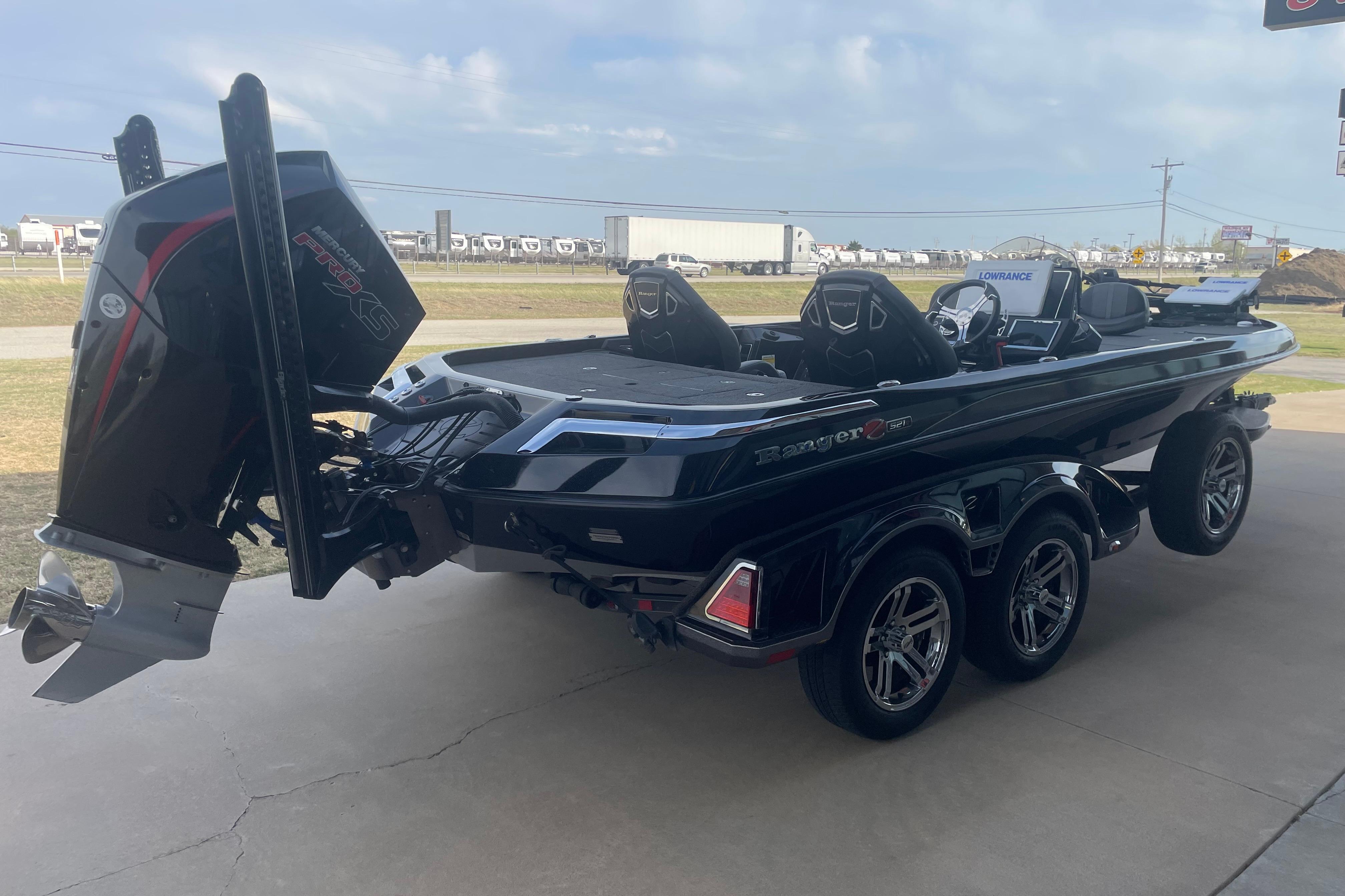 2023 Ranger Z521R boat with powerful engine and sleek design on a trailer.