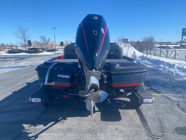 2025 Nitro Z21 XL Pro boat with powerful outboard motor in snowy parking lot.