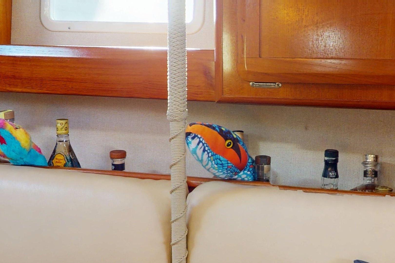 Interior of 1997 Hunter Legend 40.5 yacht with colorful decor and assorted bottles.