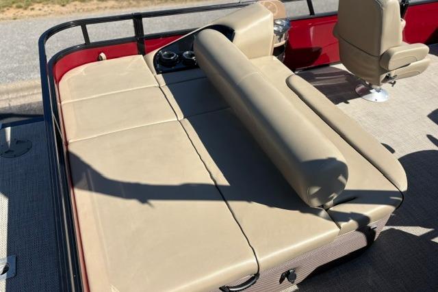 2025 Regency 250 DL3 boat with beige seating and red accents.
