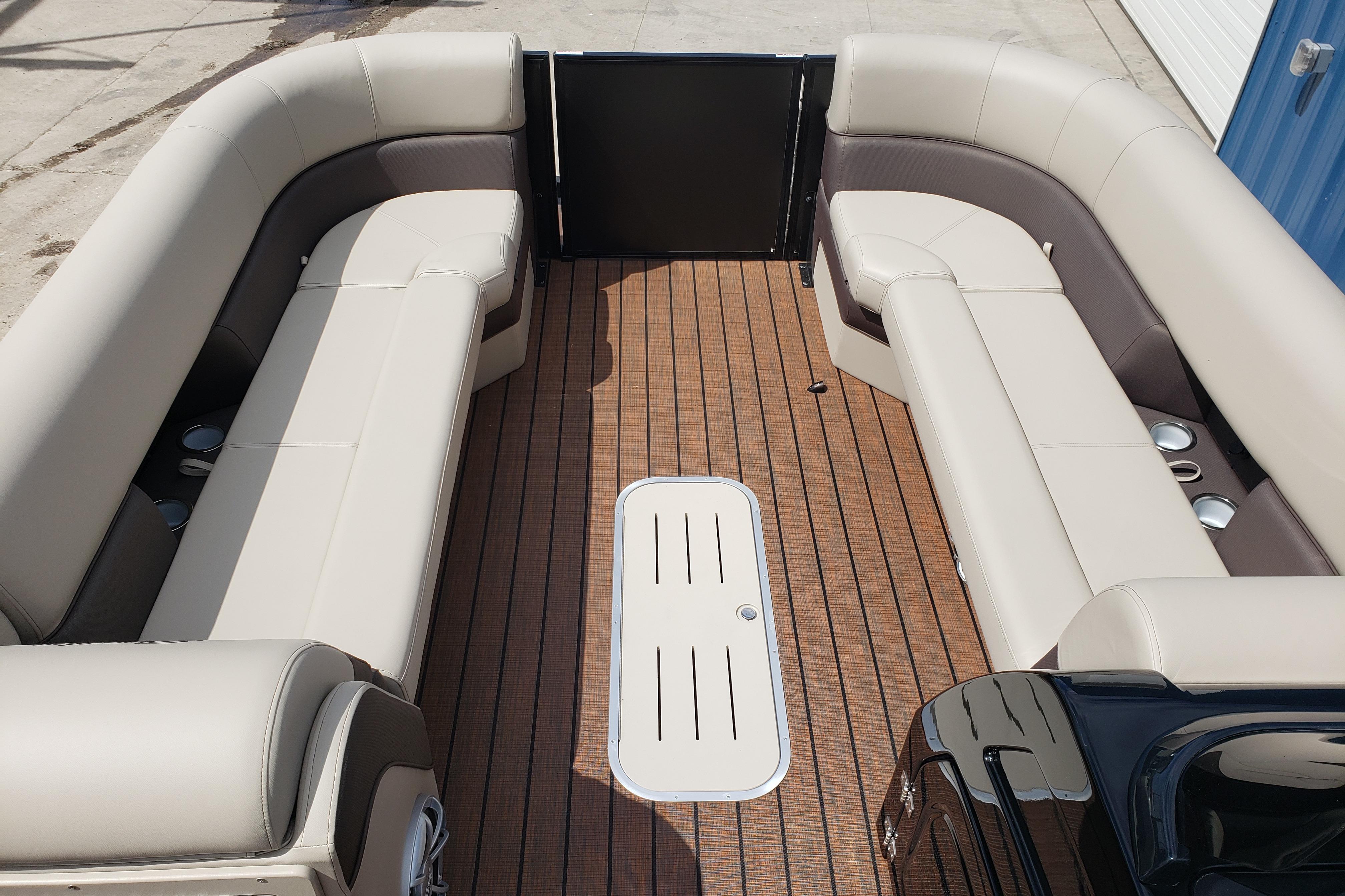 2026 Bentley Pontoons Elite 253 QSB interior with luxurious seating and wood-style flooring.