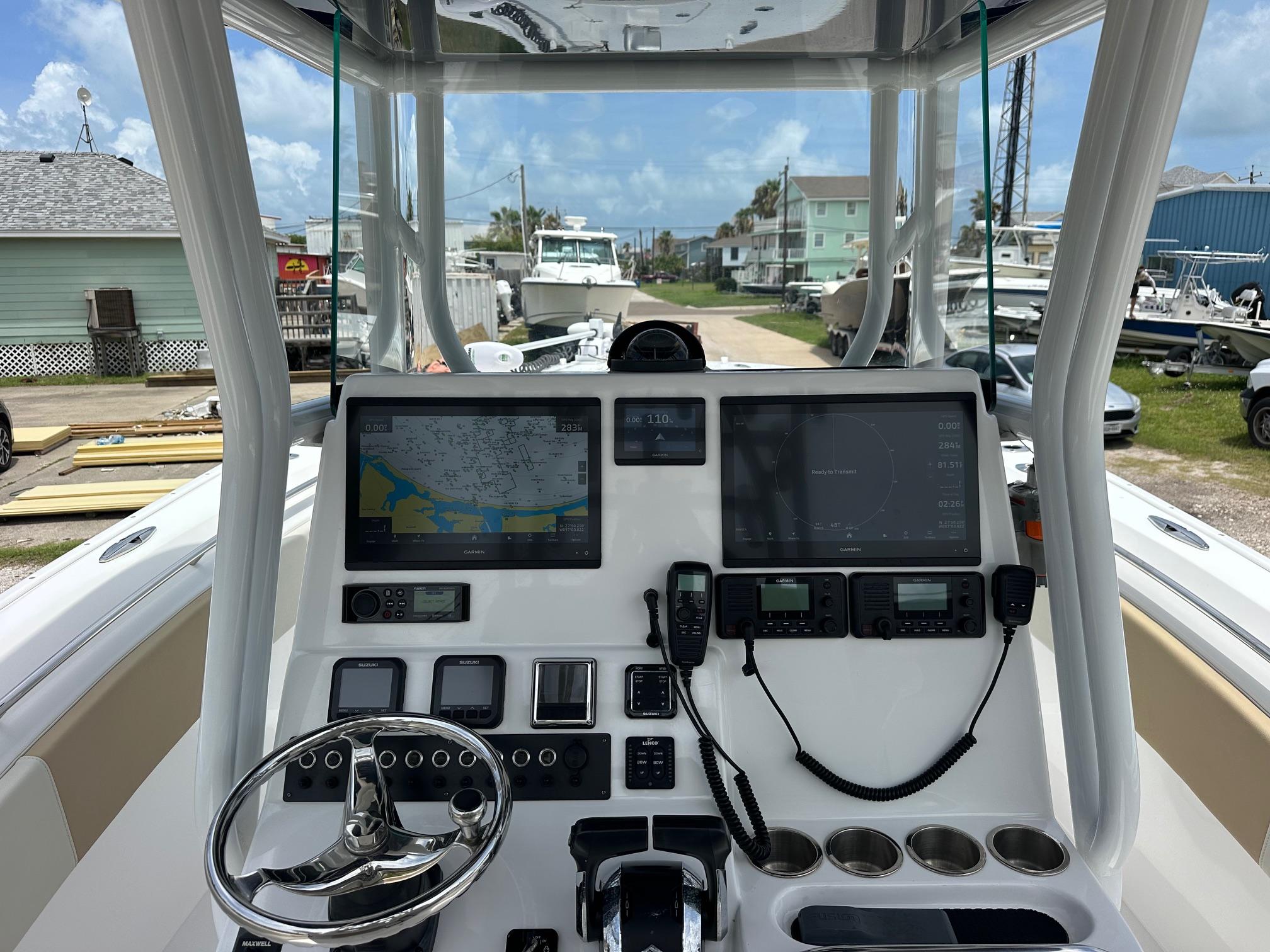 2023 Cape Horn 32xs boat dashboard with navigation screens and controls.